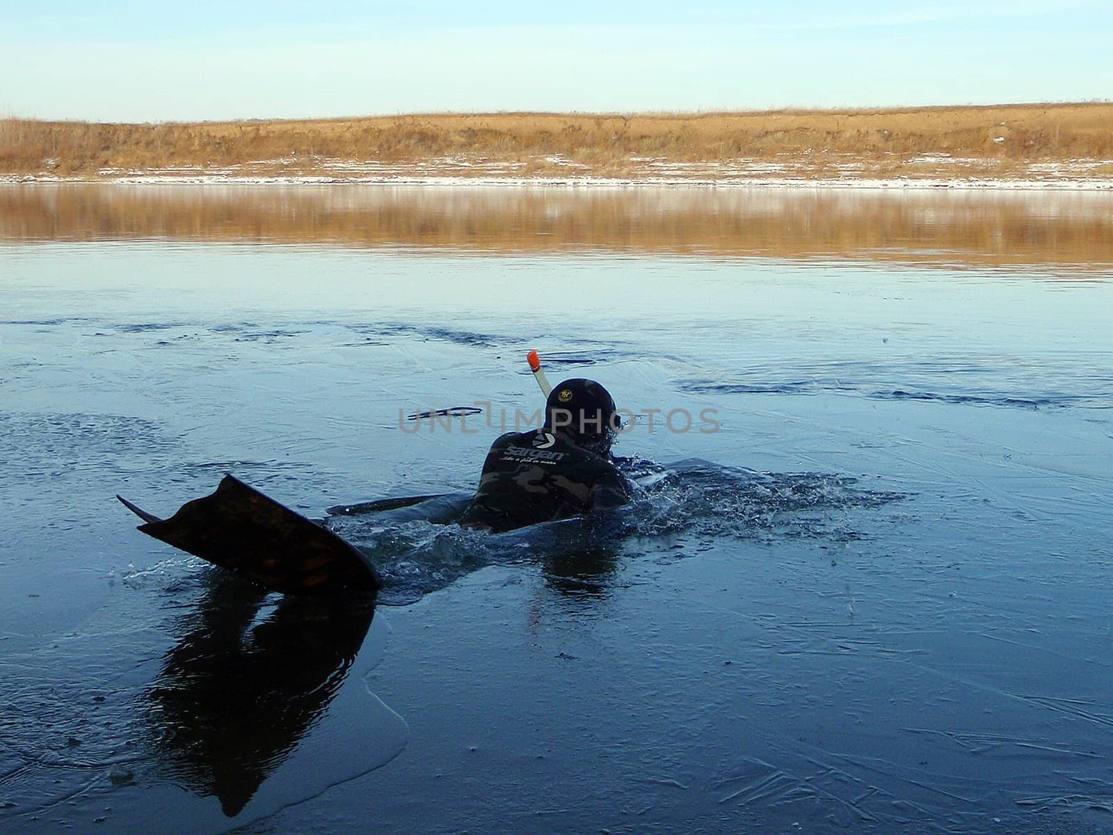 We dive on the winter river Belaya, Russia, Bashkortostan
