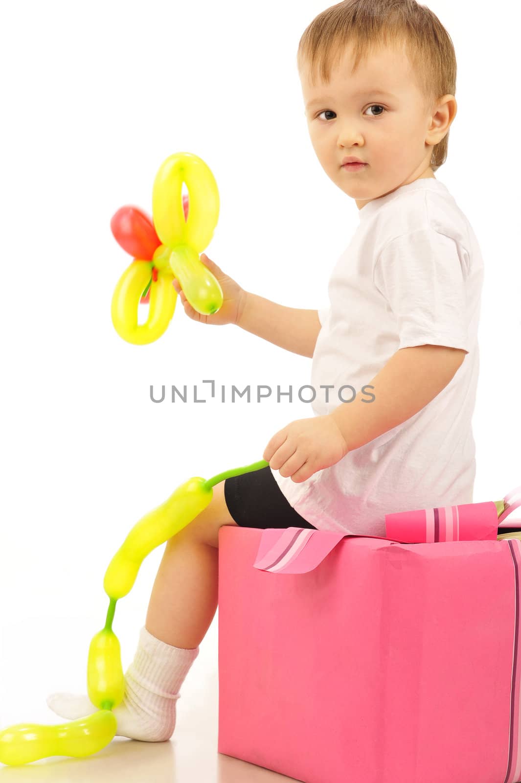 Nice little boy  is playing with balloons 