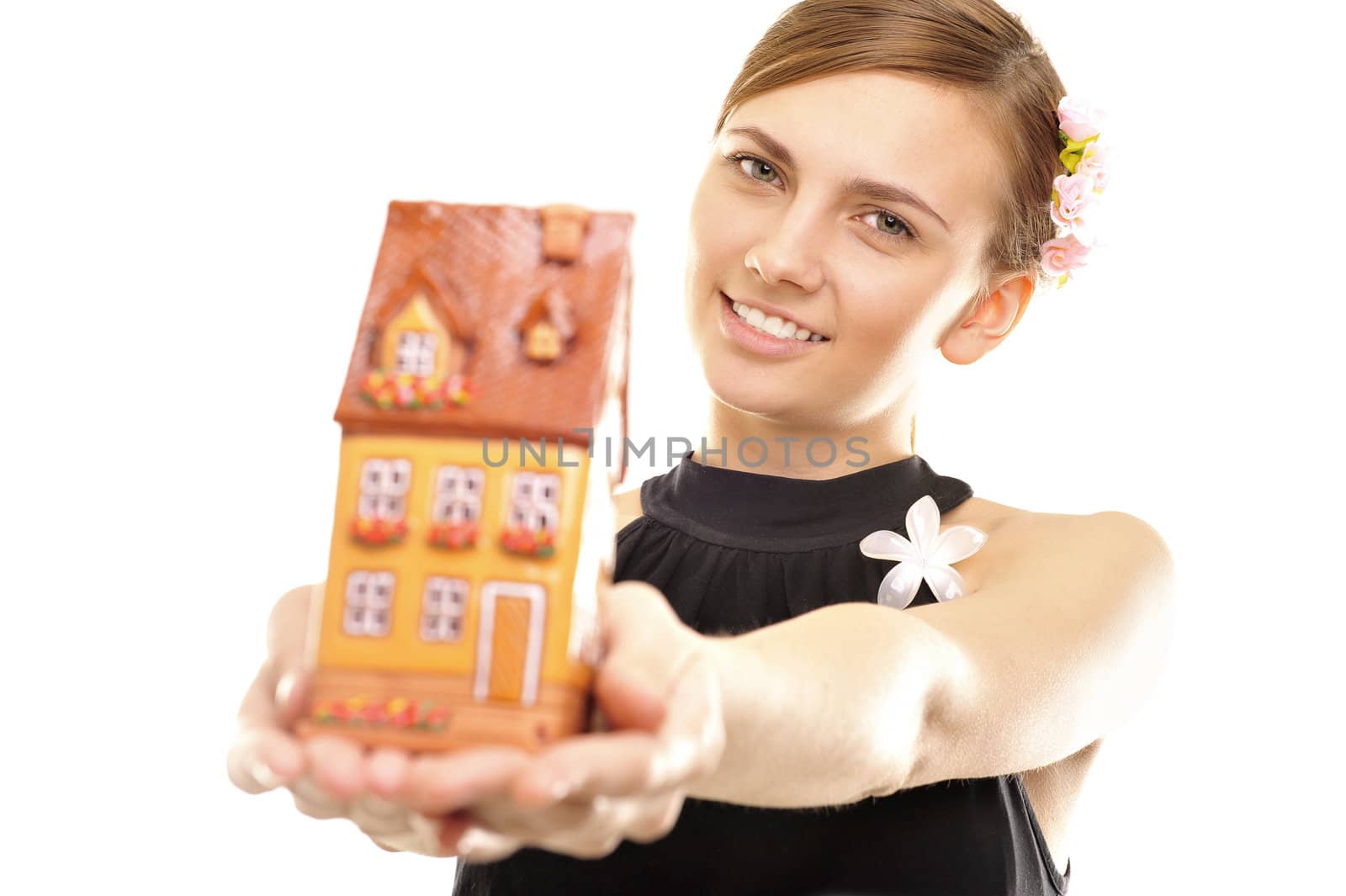 Concept image of a woman holding house isolated on white