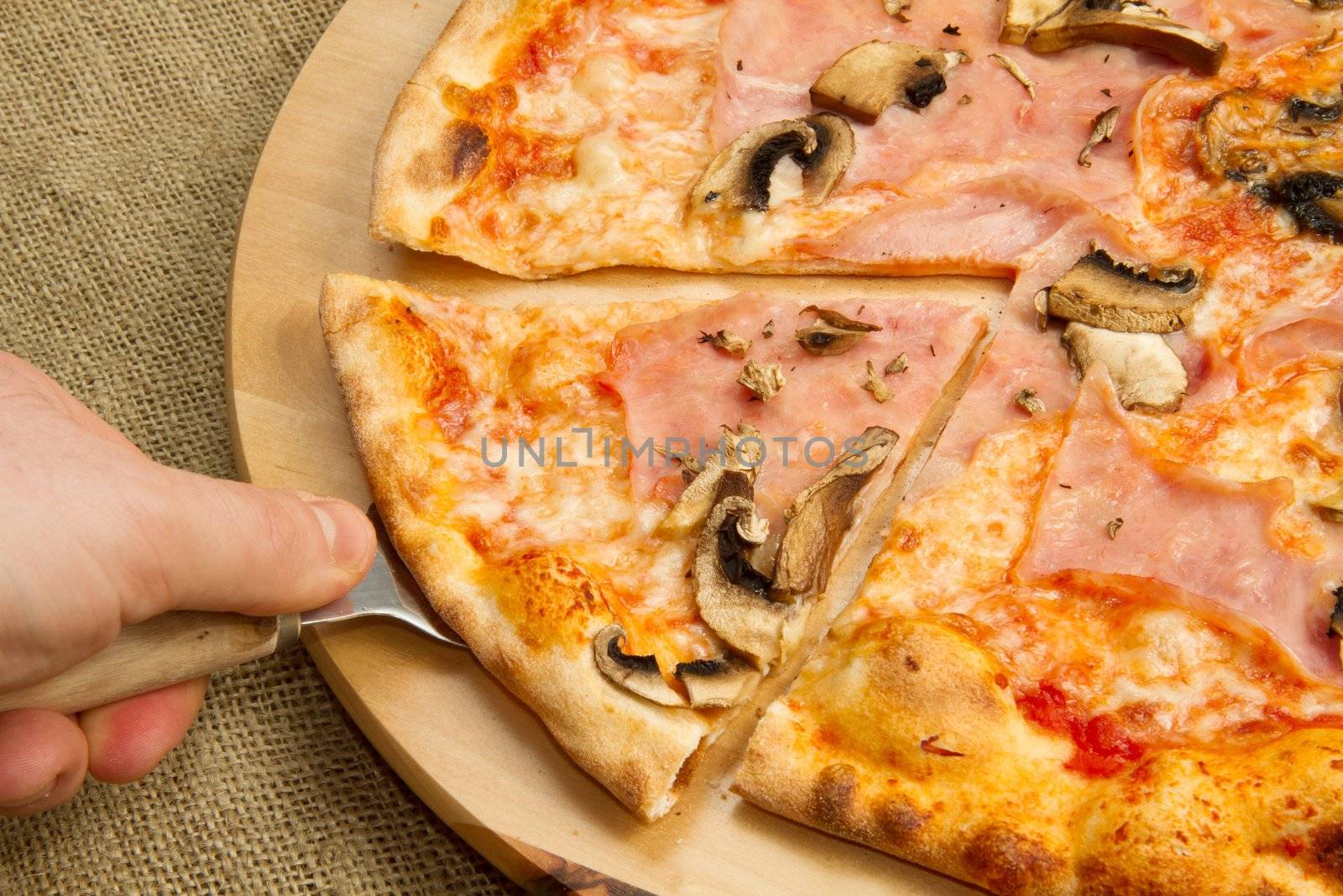 pizza on wooden cutting board