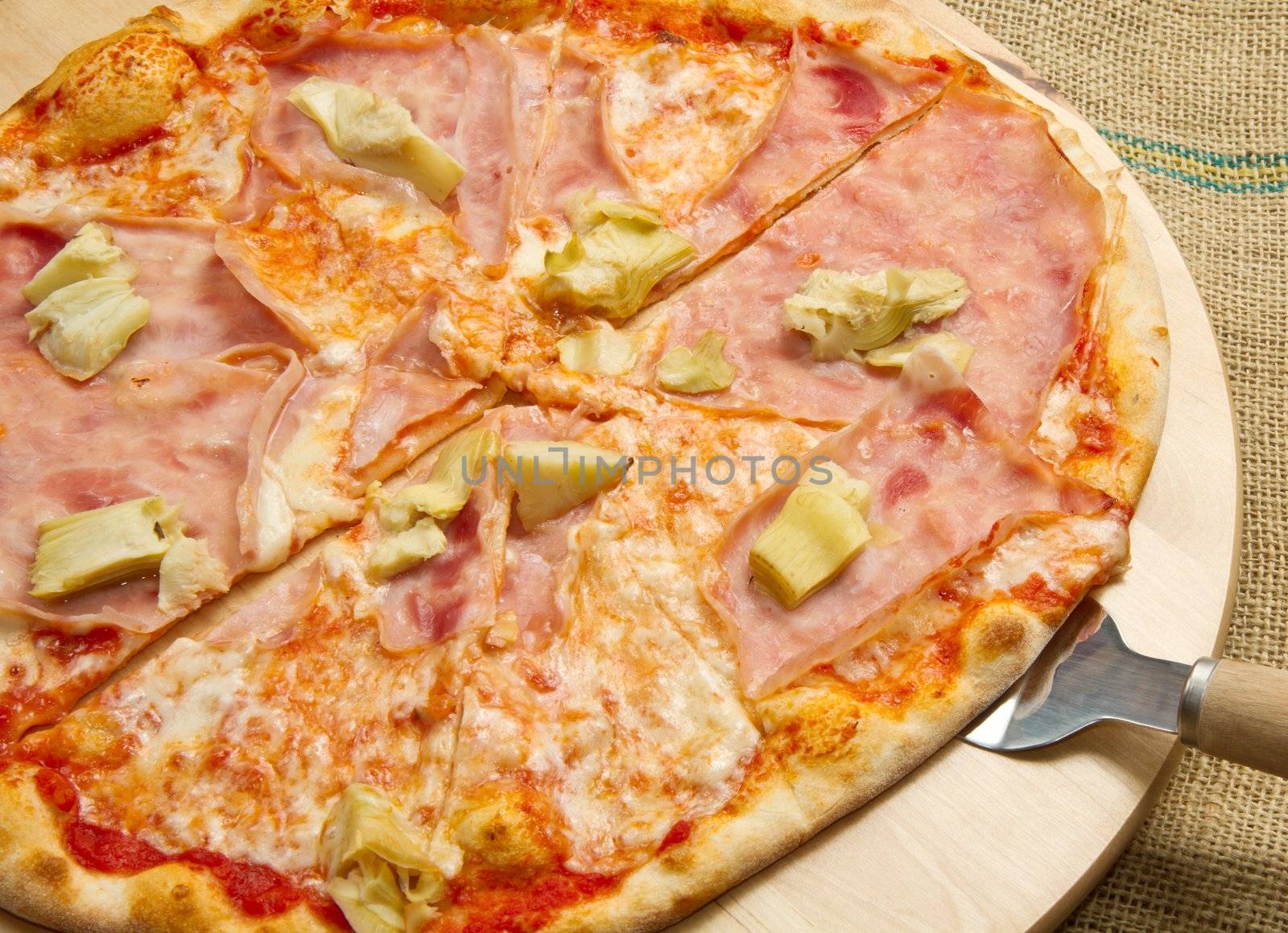 pizza on wooden cutting board