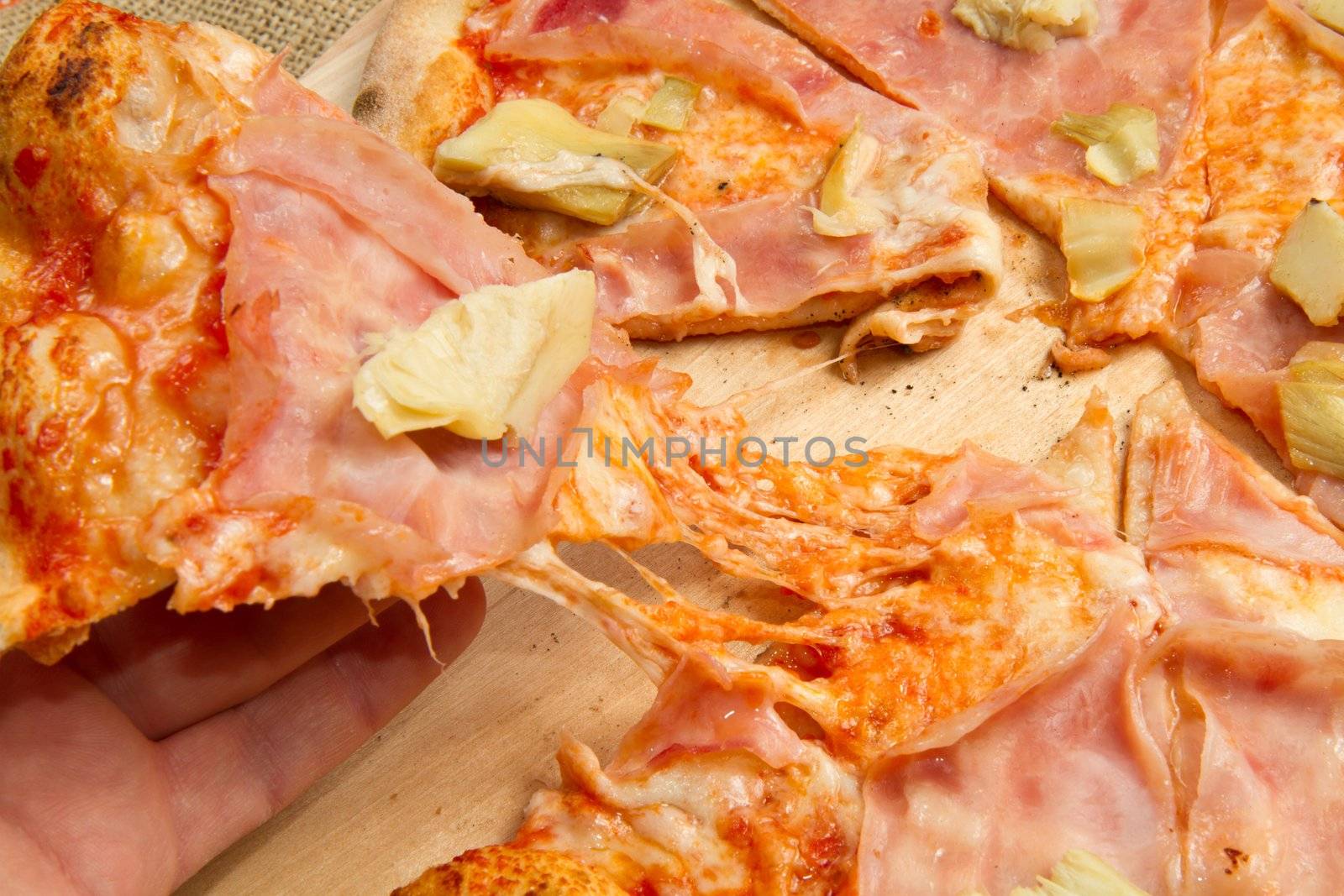 pizza on wooden cutting board