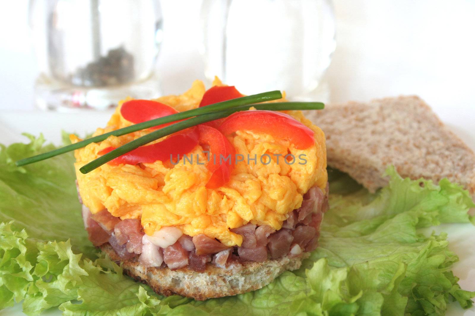 Scrambled eggs on toast and green salad