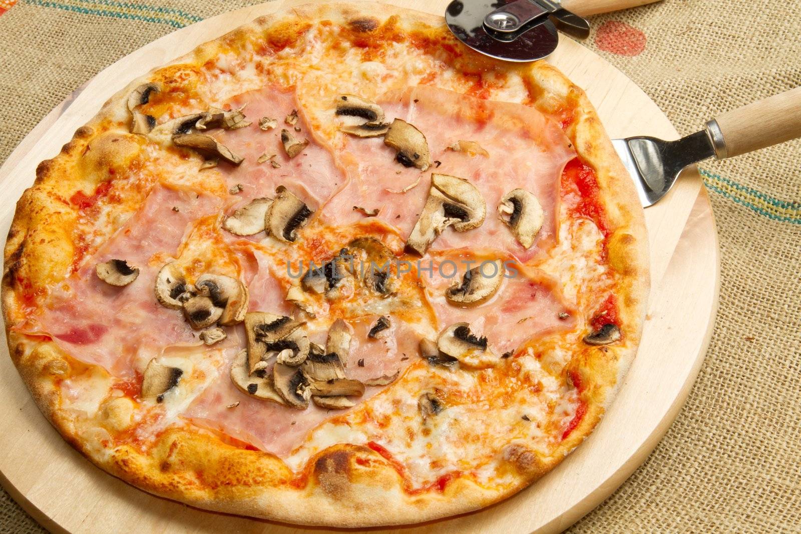 pizza on wooden cutting board