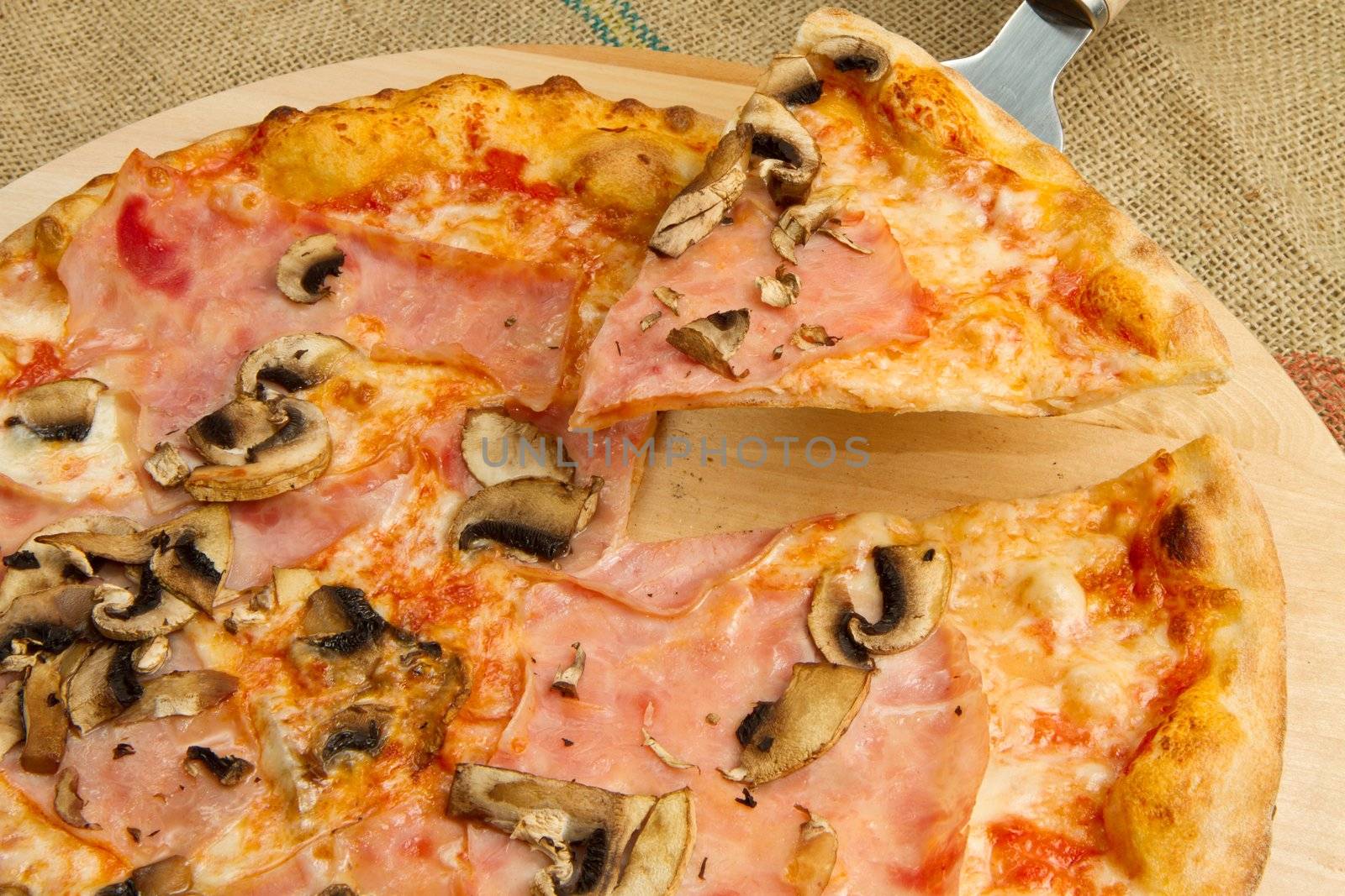pizza on wooden cutting board