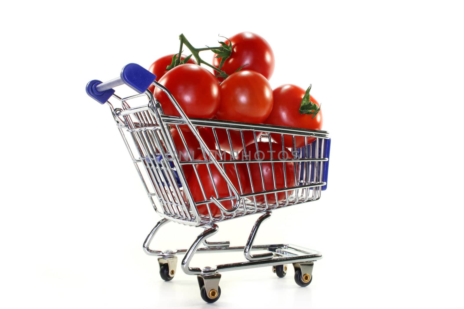 a shopping cart filled with fresh tomatoes