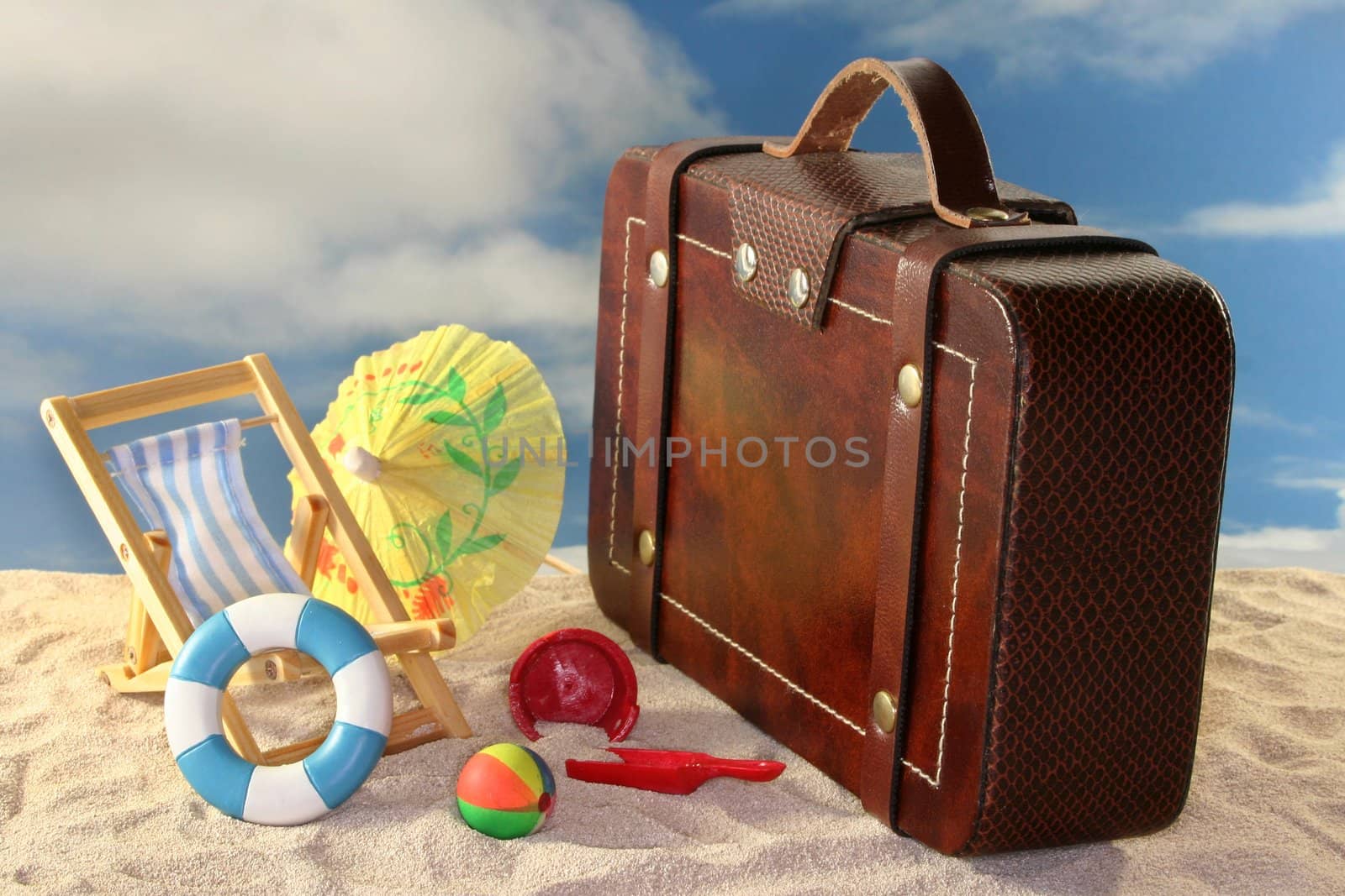 Deck chair and sun umbrella on a sandy beach