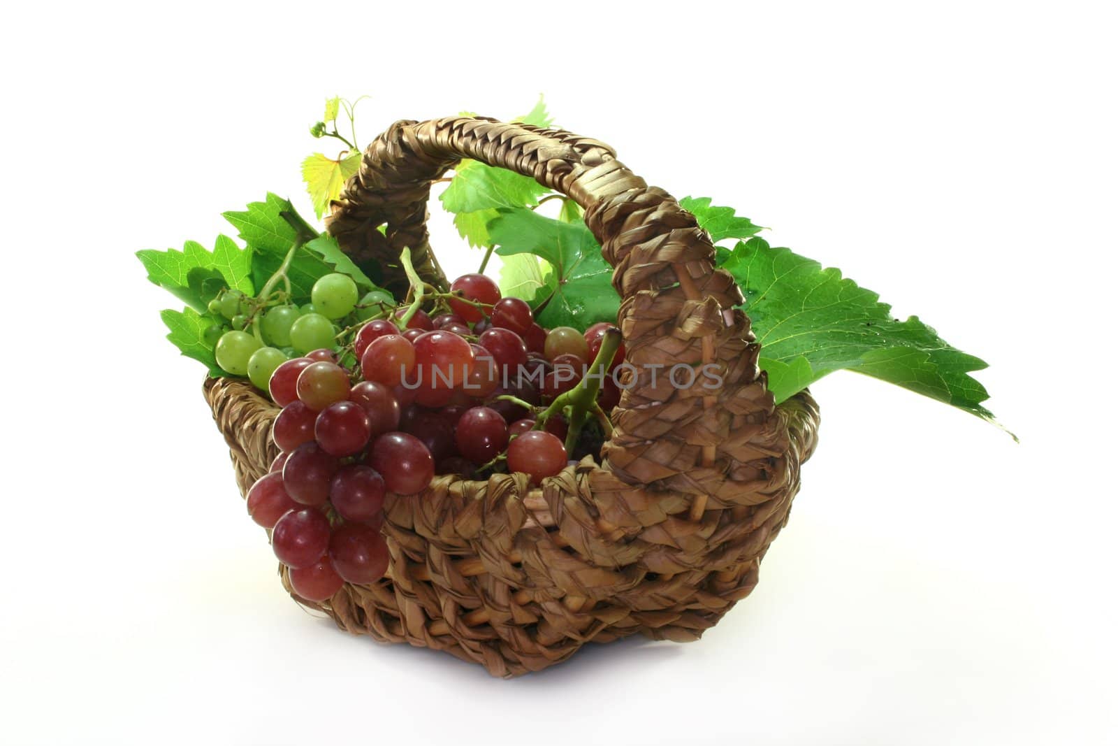 Grapes and vine leaves in a basket