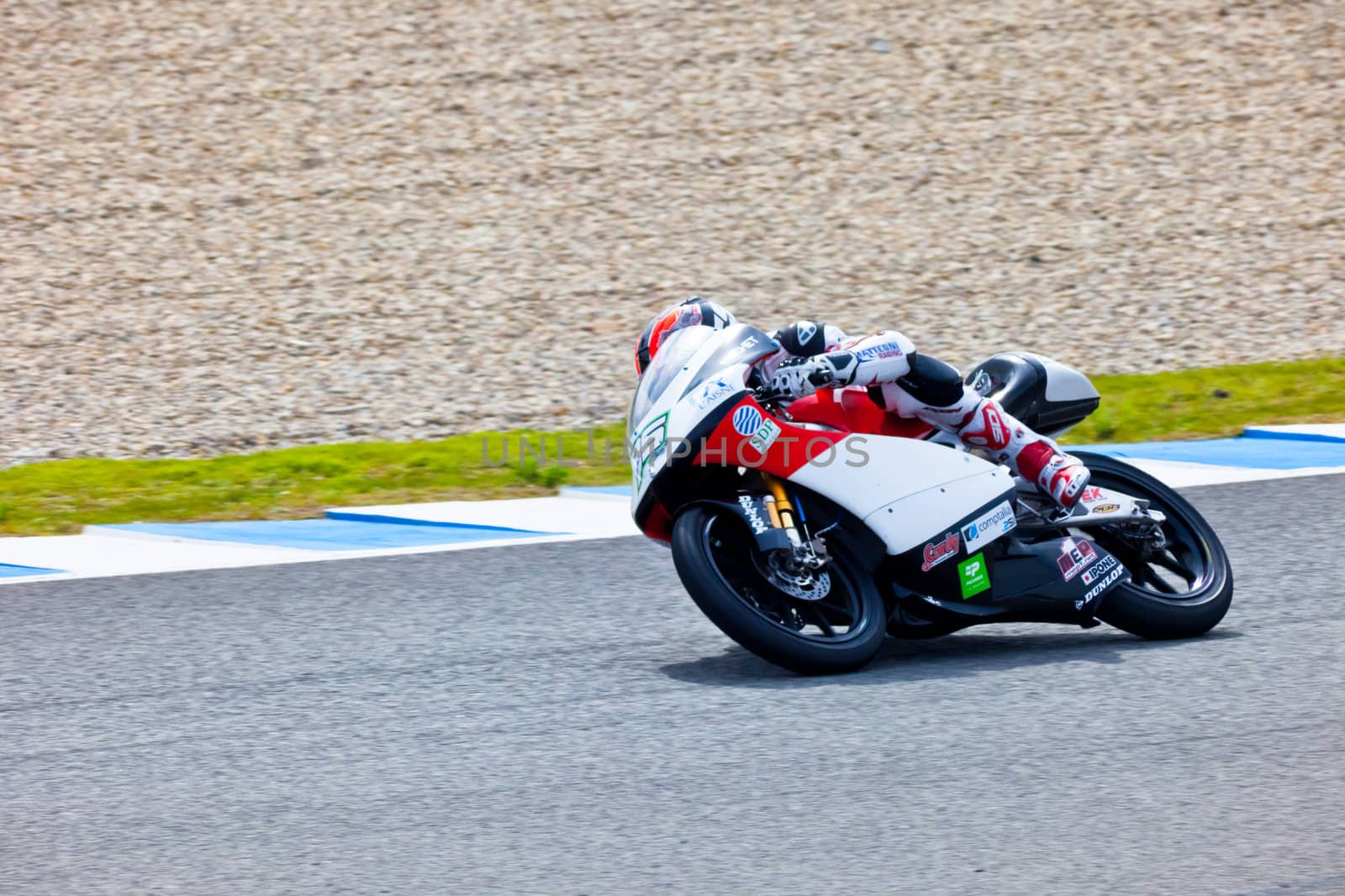 JEREZ DE LA FRONTERA, SPAIN - MAR 5: 125cc motorcyclist Louis Rossi races on the official training of the world championship of MotoGP on March 5, 2011 in Jerez de la Frontera, Spain
