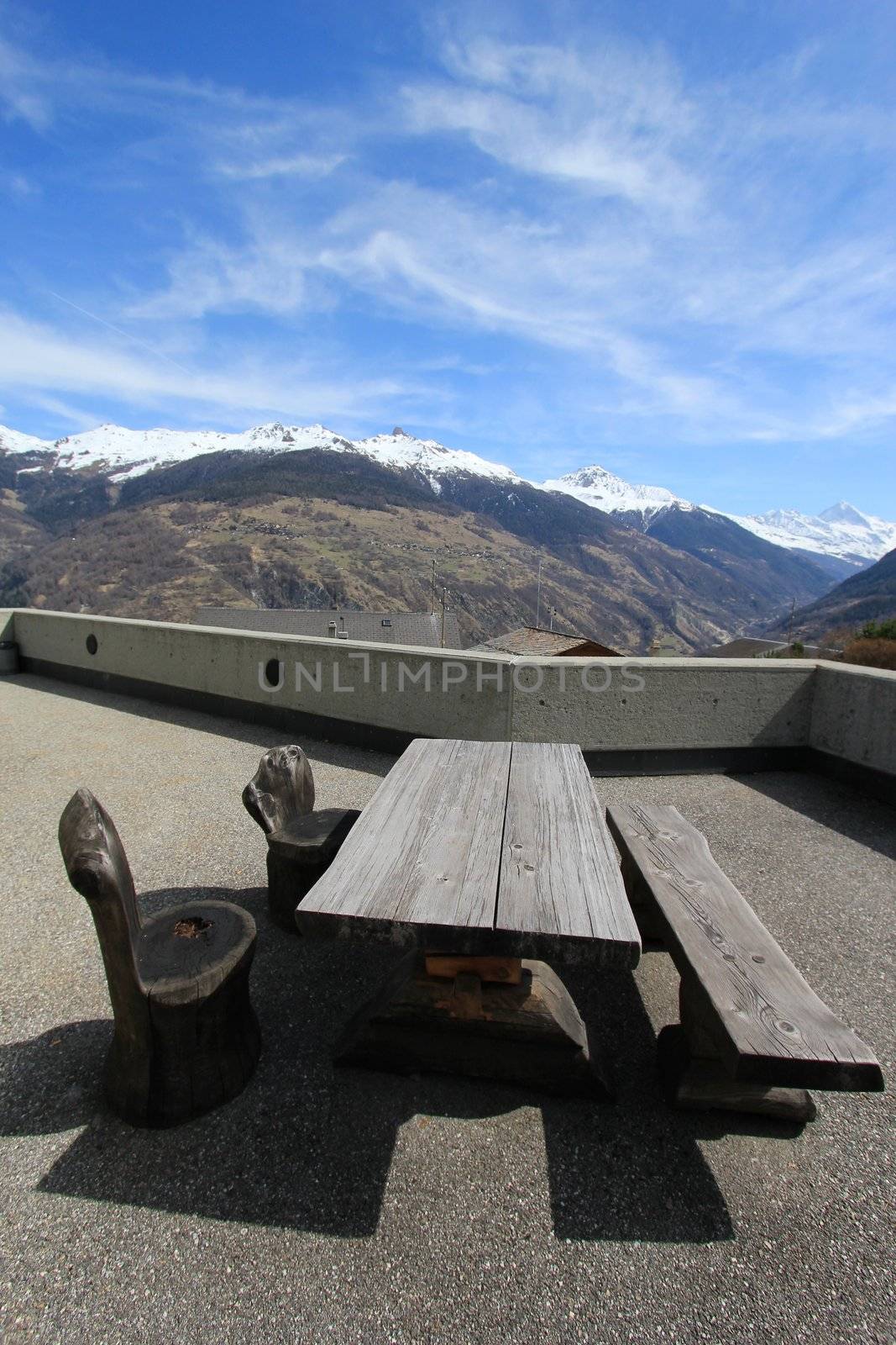Bench and tables at the mountain by Elenaphotos21