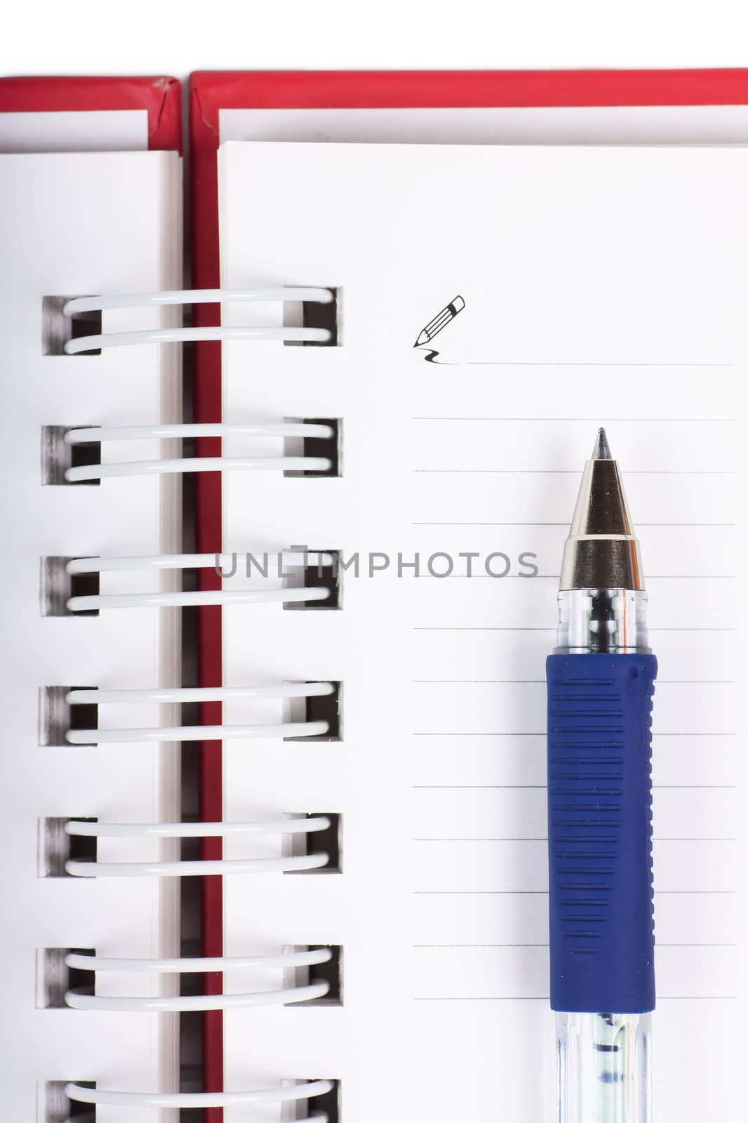 Macro view of blank spiral notebook and pen
