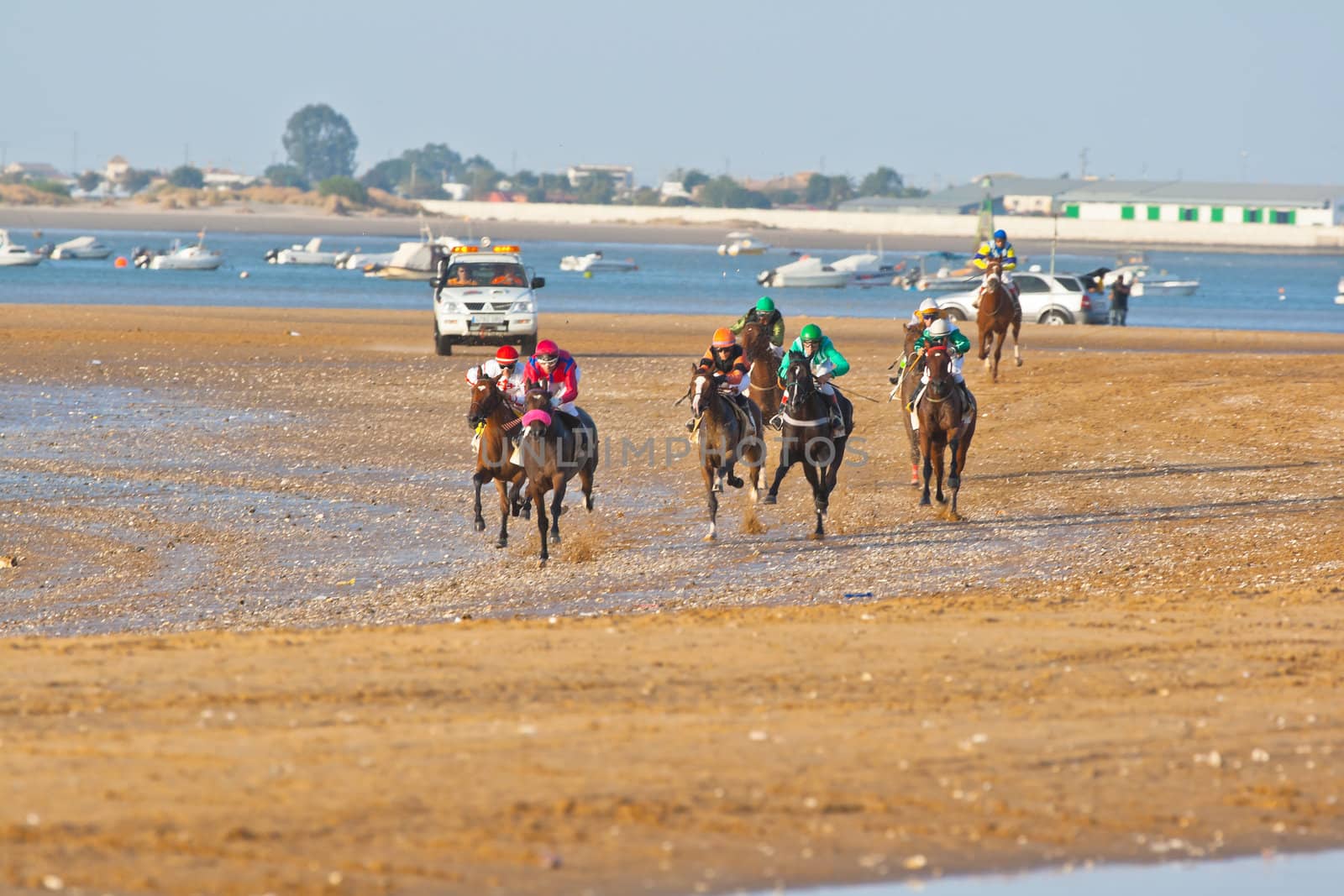 SANLUCAR DE BARRAMEDA, CADIZ, SPAIN - AUGUST 07: Unidentified riders race horses on Sanlucar de Barrameda beach on August 28, 2008 in Sanlucar de Barrameda, Cadiz, Spain.