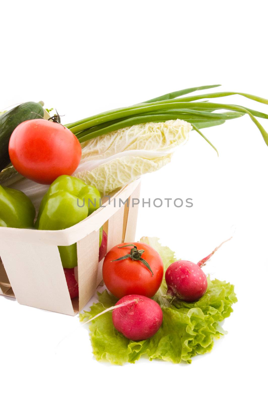 Wattled basket with vegetable over white
