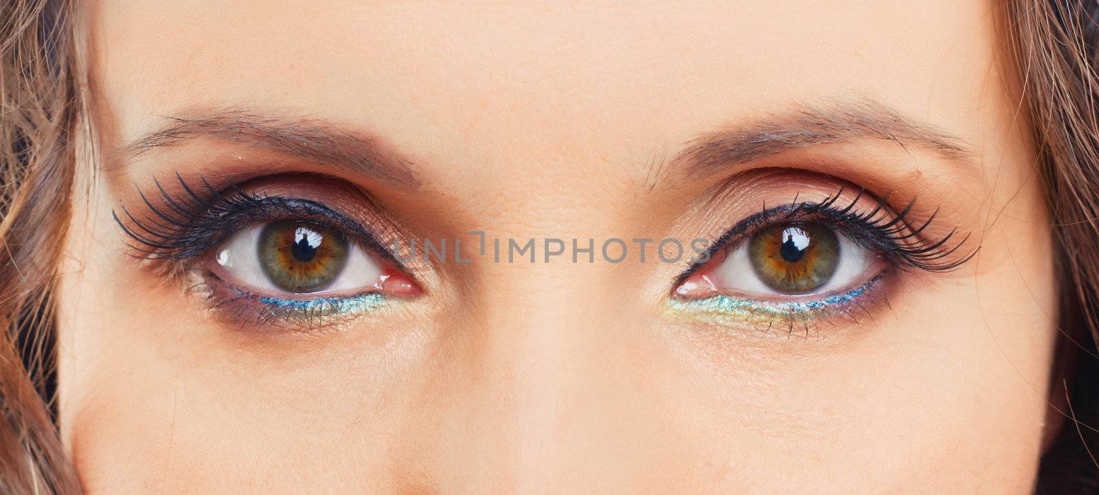 Close-up eyes of the young woman with fashion make-up