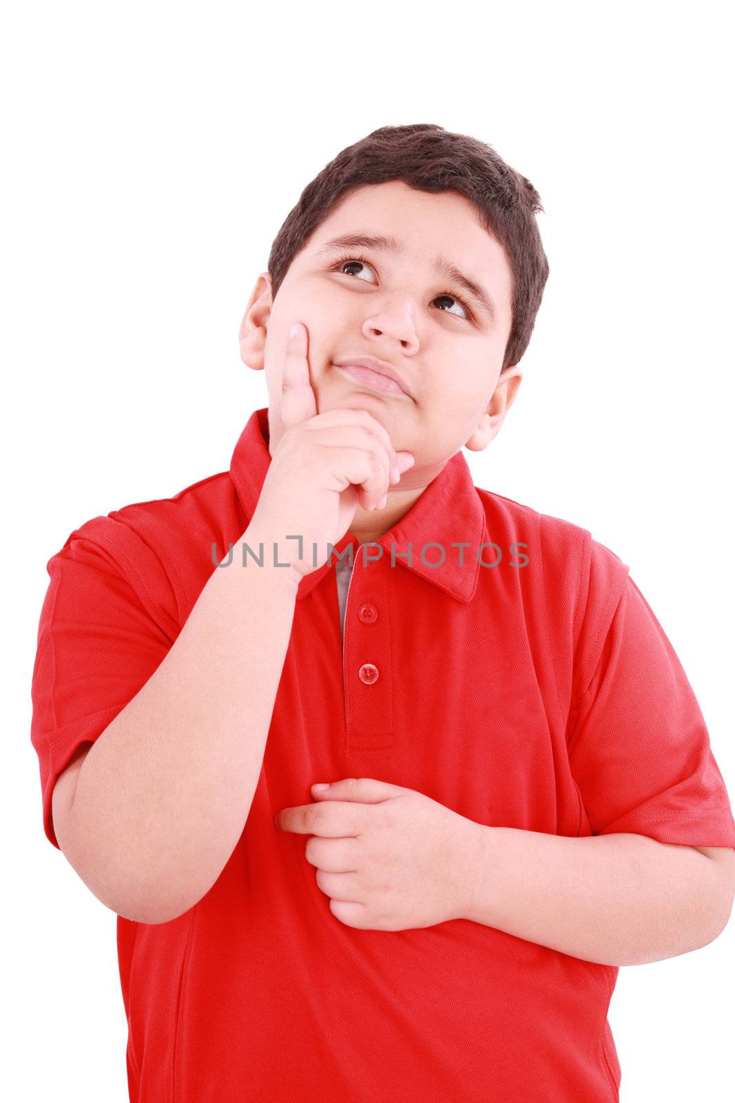 Child with a pensive expression looking up. Isolated on white background.