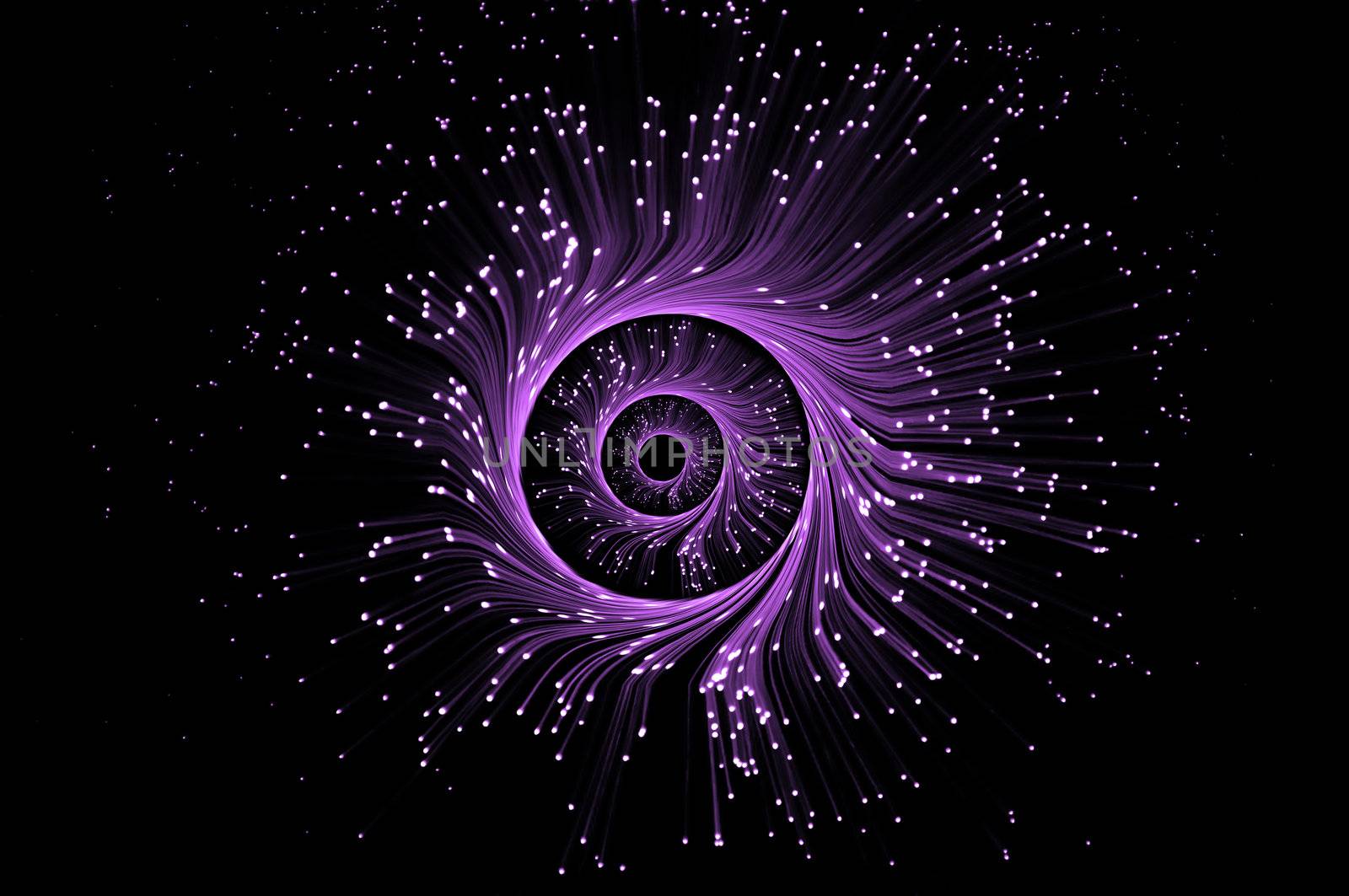 Illuminted purple fibre optic light strands forming three swirling rings against a black blackground.