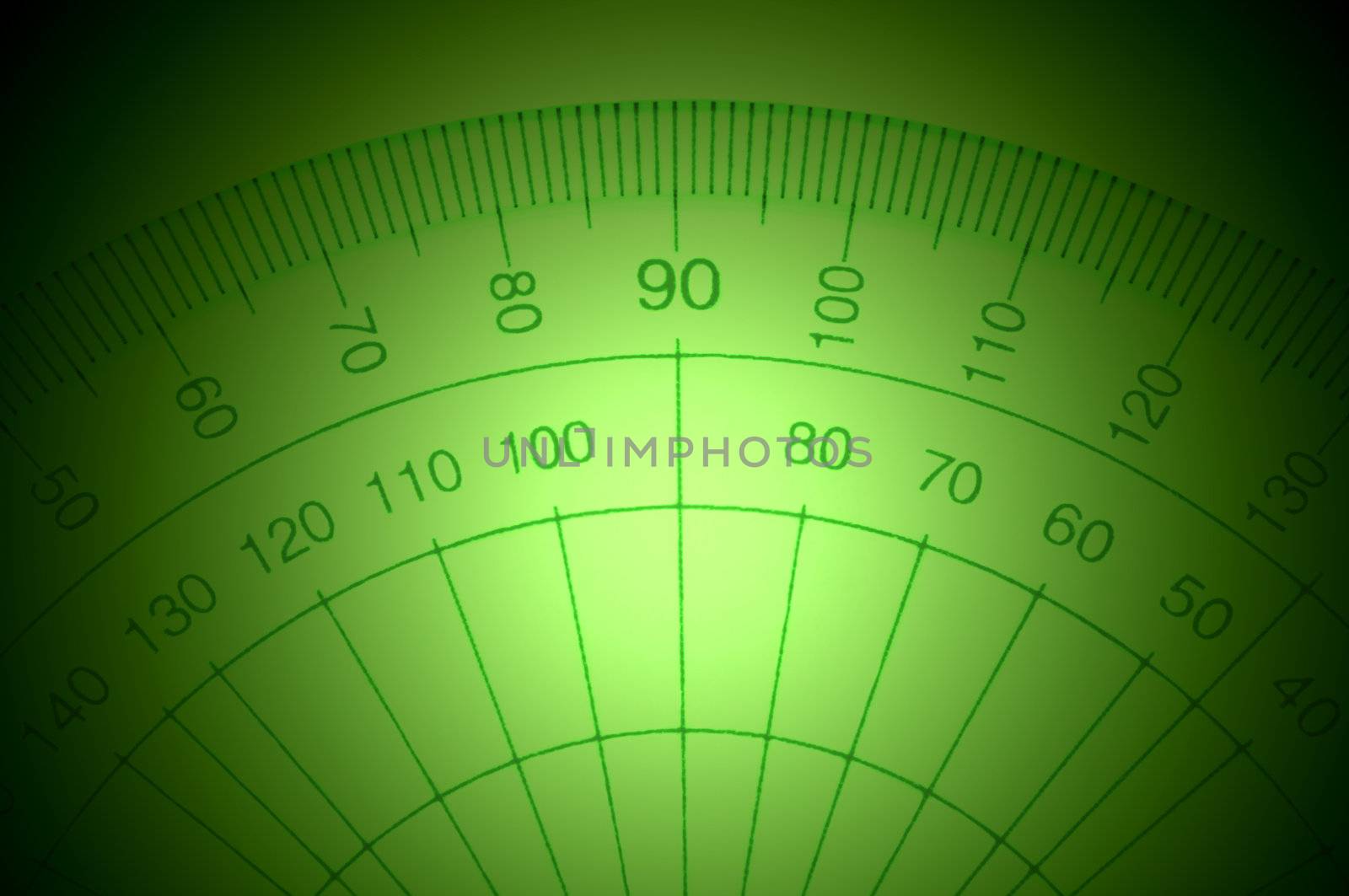 Close Up capturing a portion of a transparent plastic protractor arranged over deep green light effect