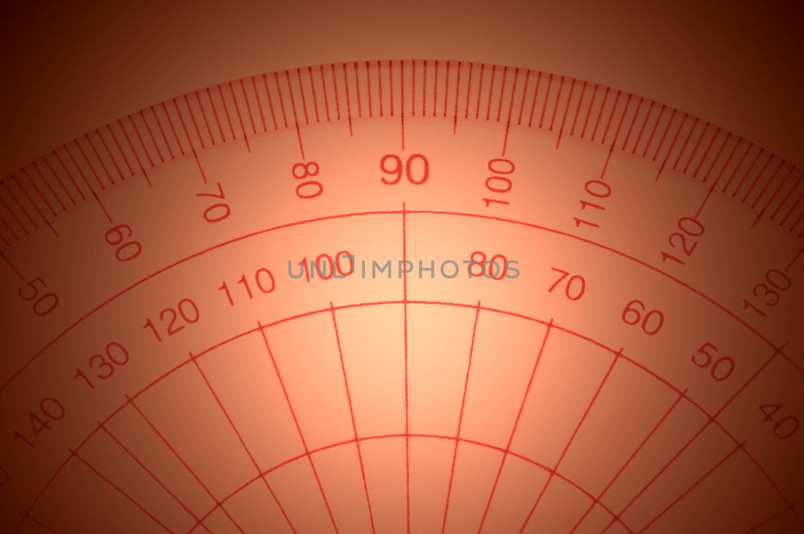 Close Up capturing a portion of a transparent plastic protractor arranged over red light effect filter