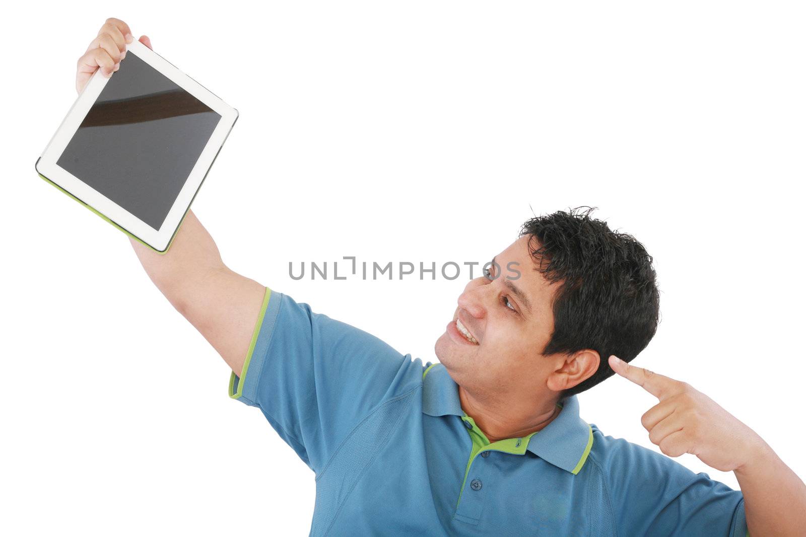 Laughing casual young man holding a touch pad tablet pc on isolated white background