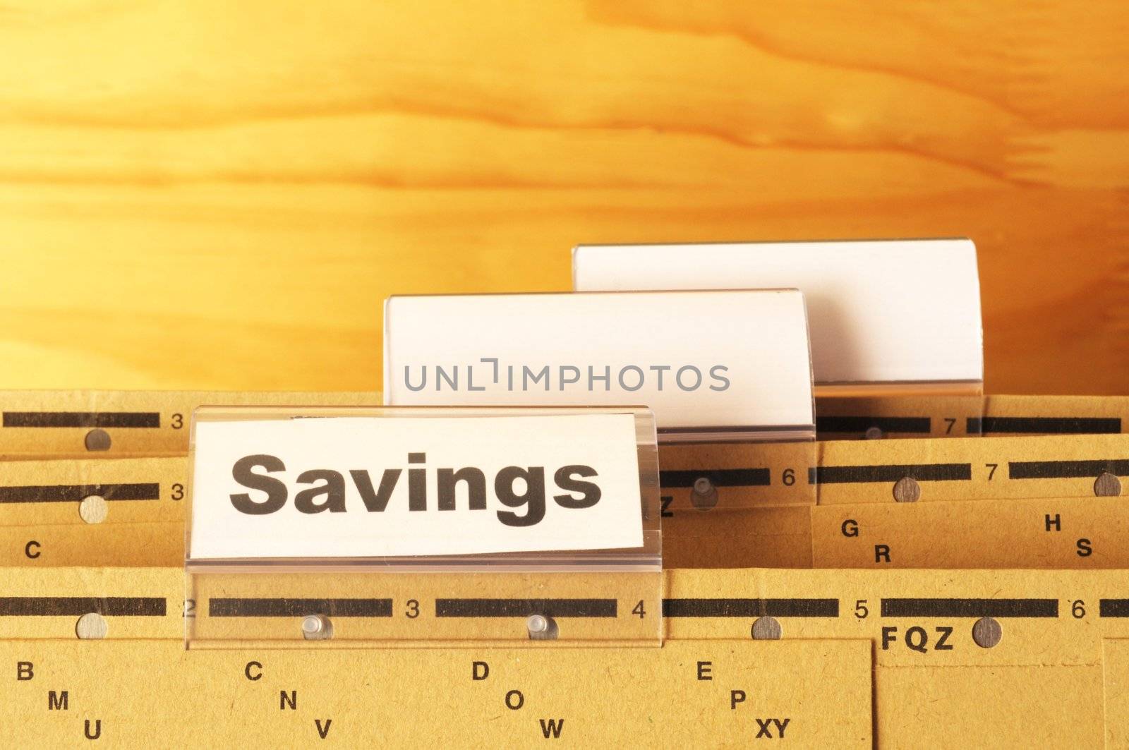 savings word on business folder showing saving money concept