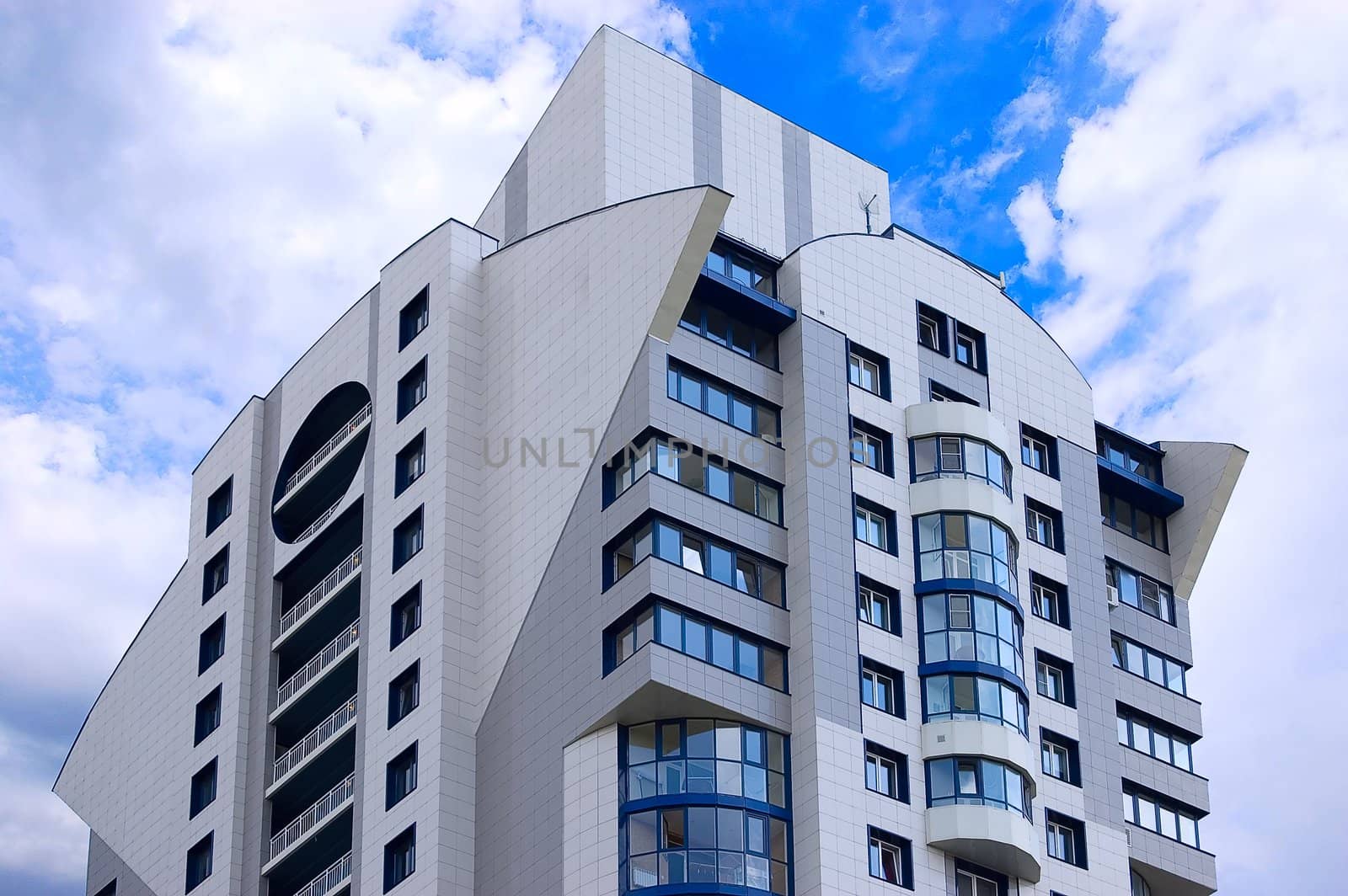 Modern office building on blue sky background