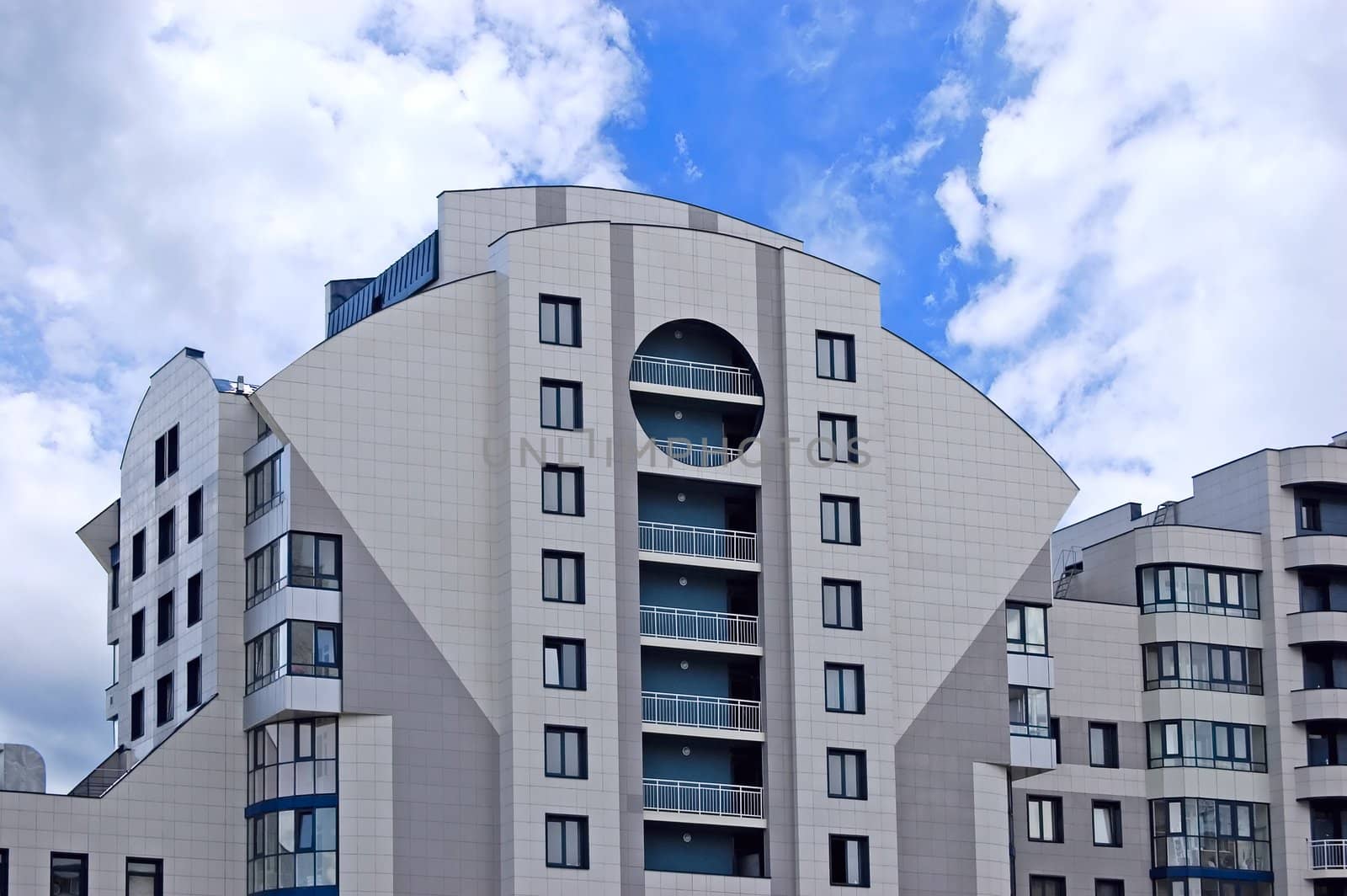 Modern office building on blue sky background