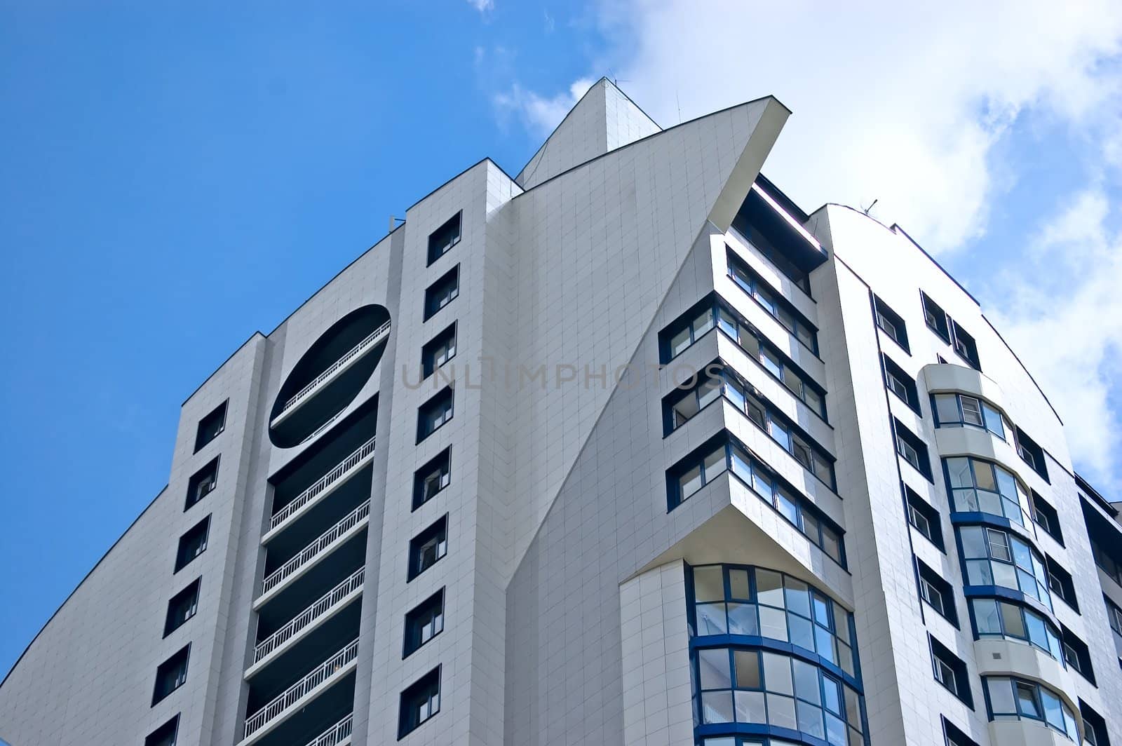 Modern office building on blue sky background