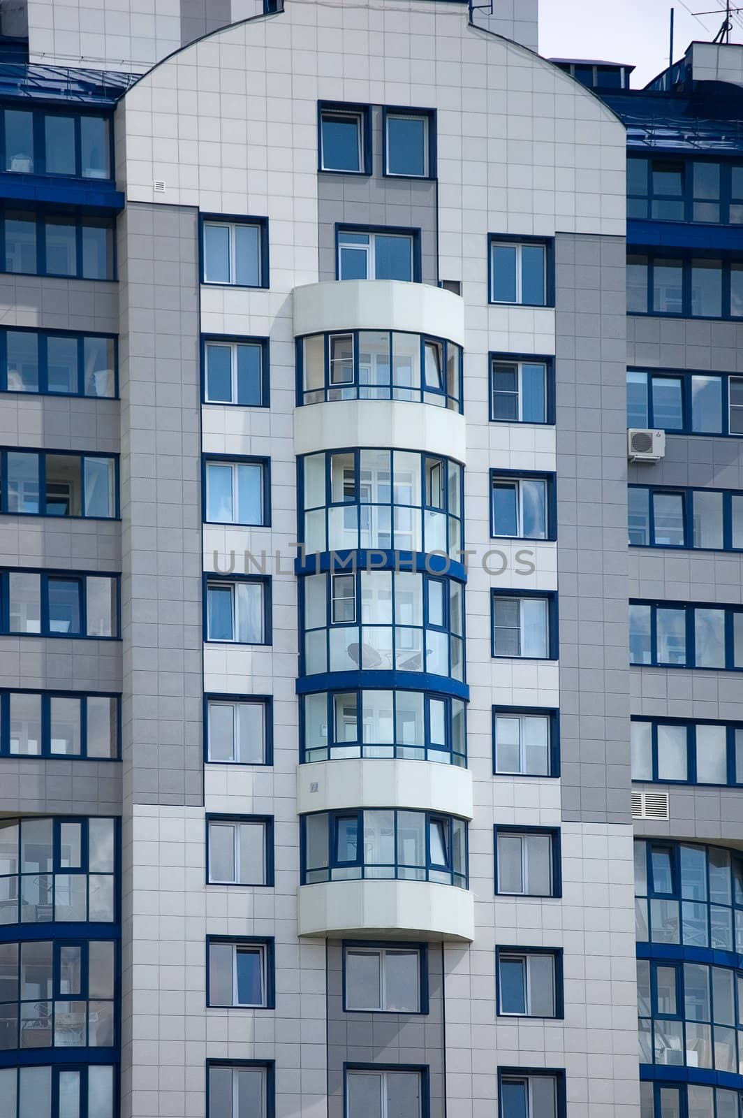 Modern office building on blue sky background