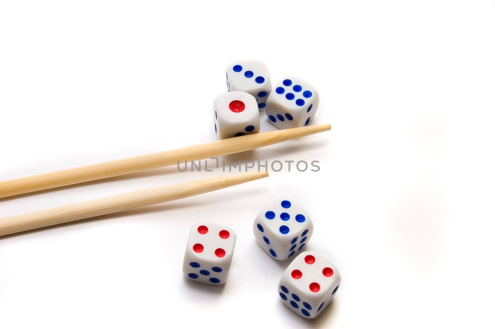 Chopsticks and dices on white background