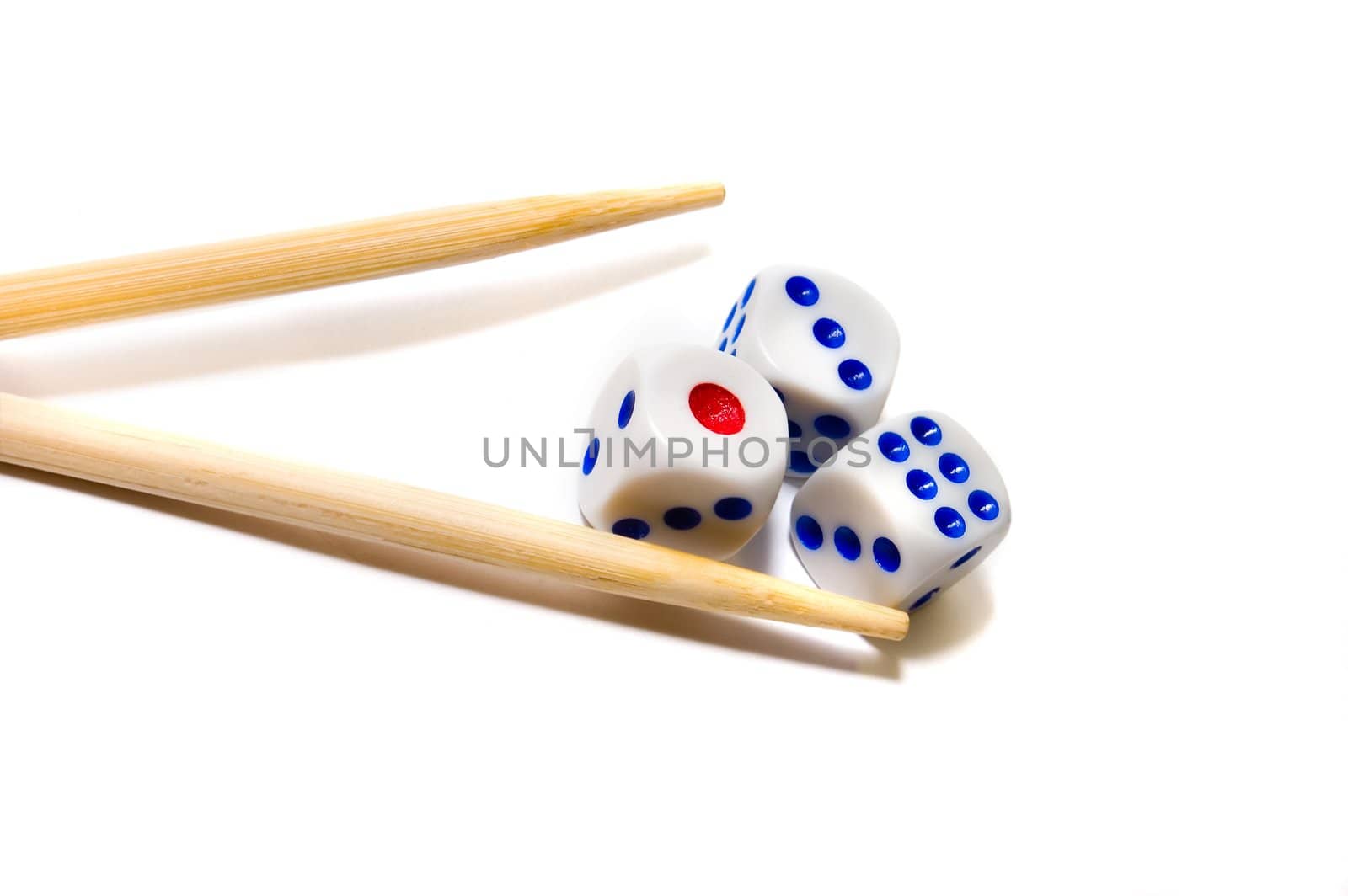 Chopsticks and dices on white background