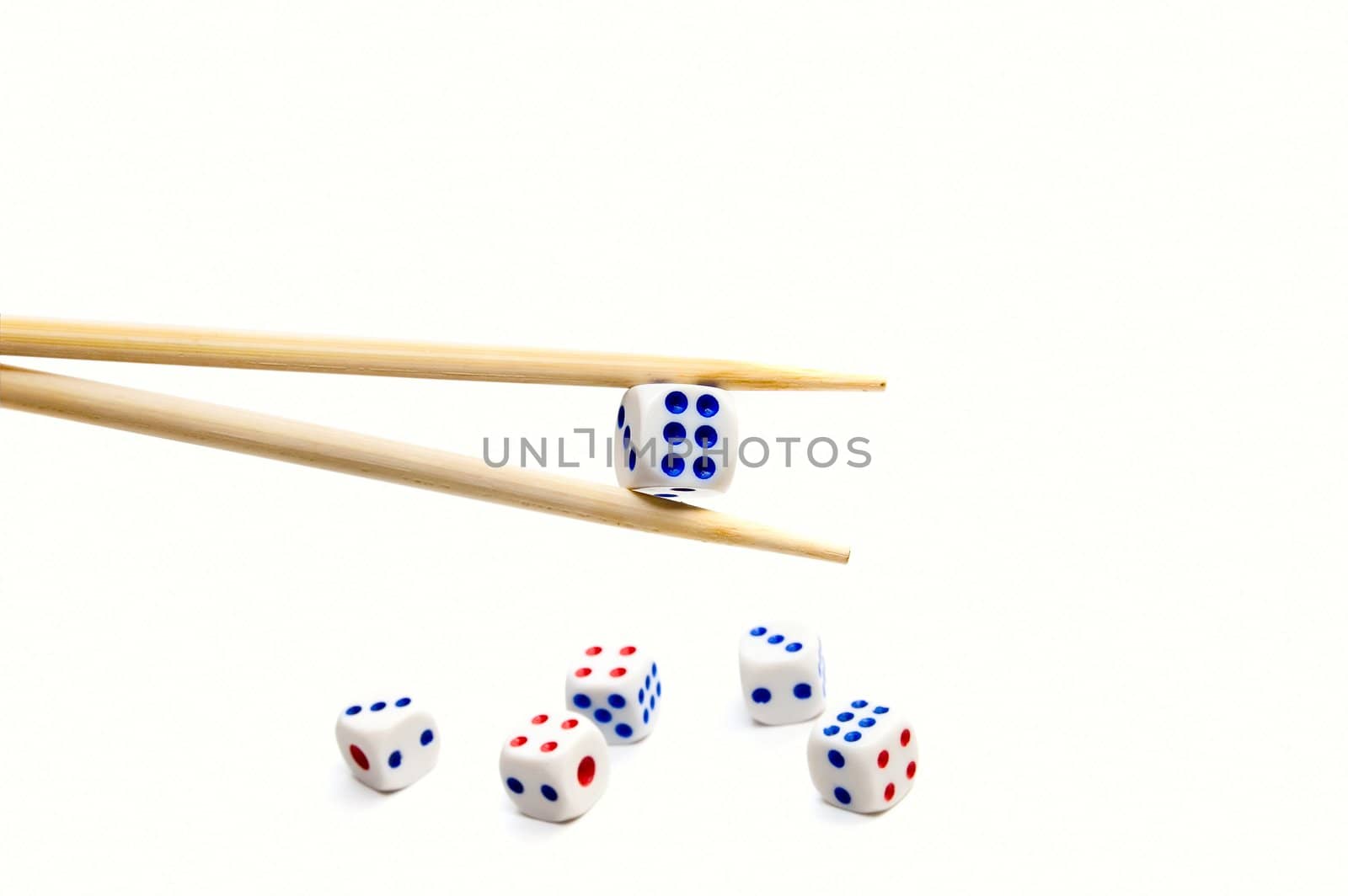 Chopsticks and dices on white background by rusak