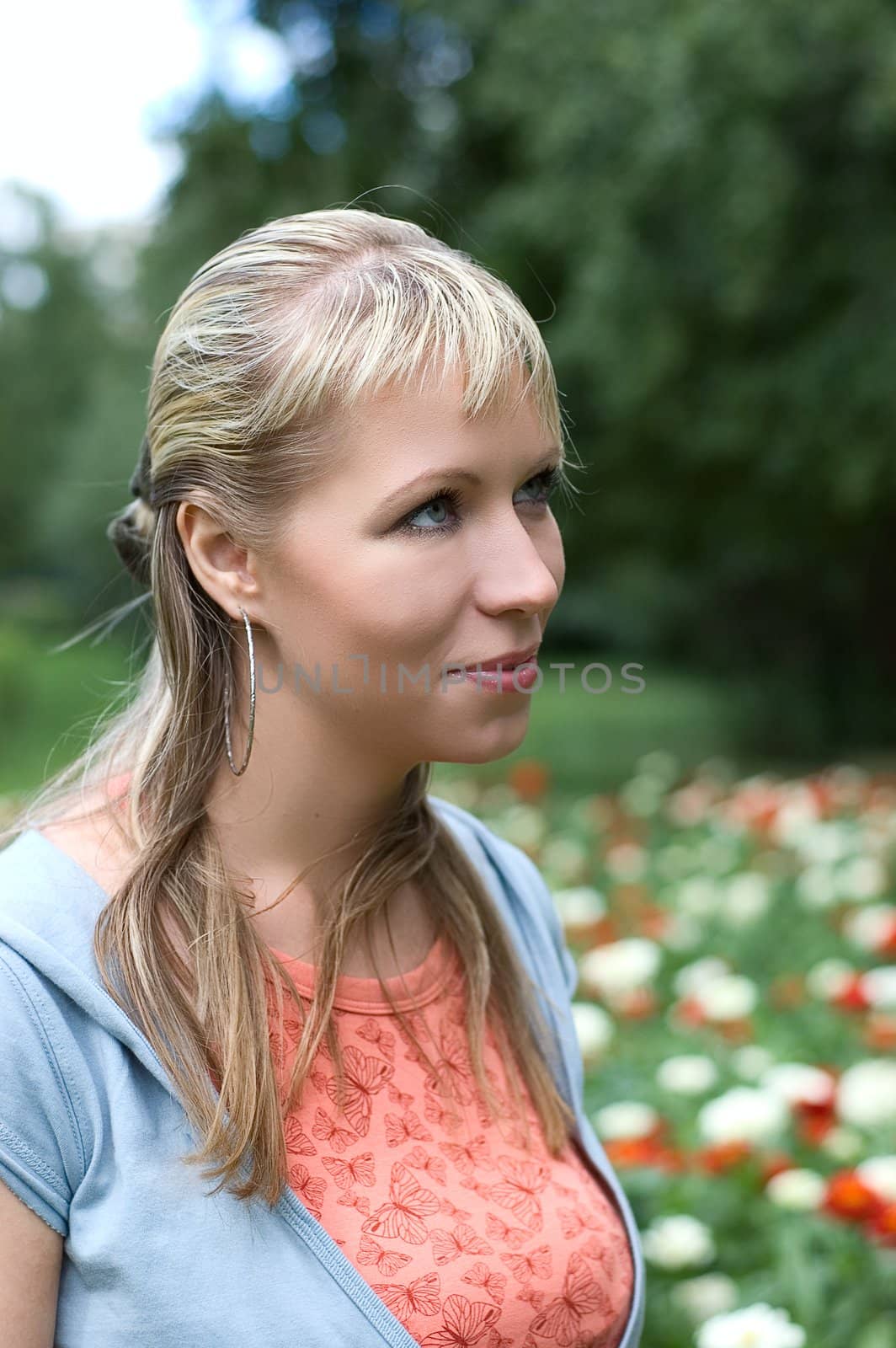 Portrait of the beautiful girl on natural background
