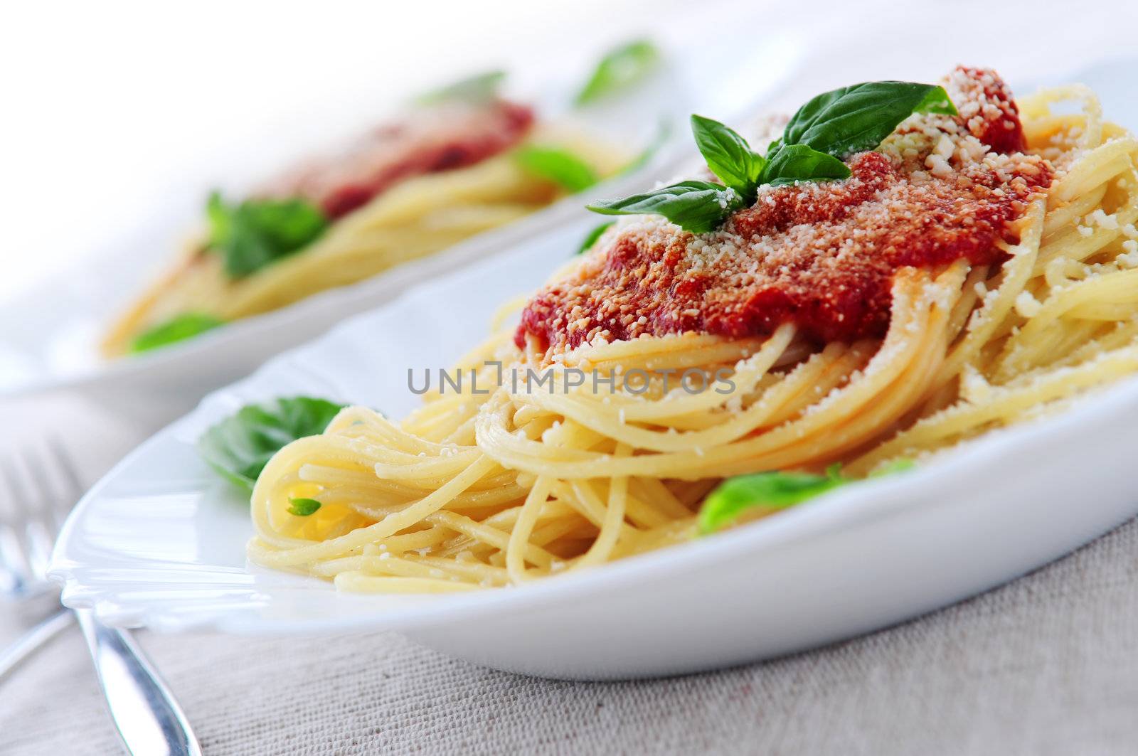 Pasta with tomato sauce basil and grated parmesan