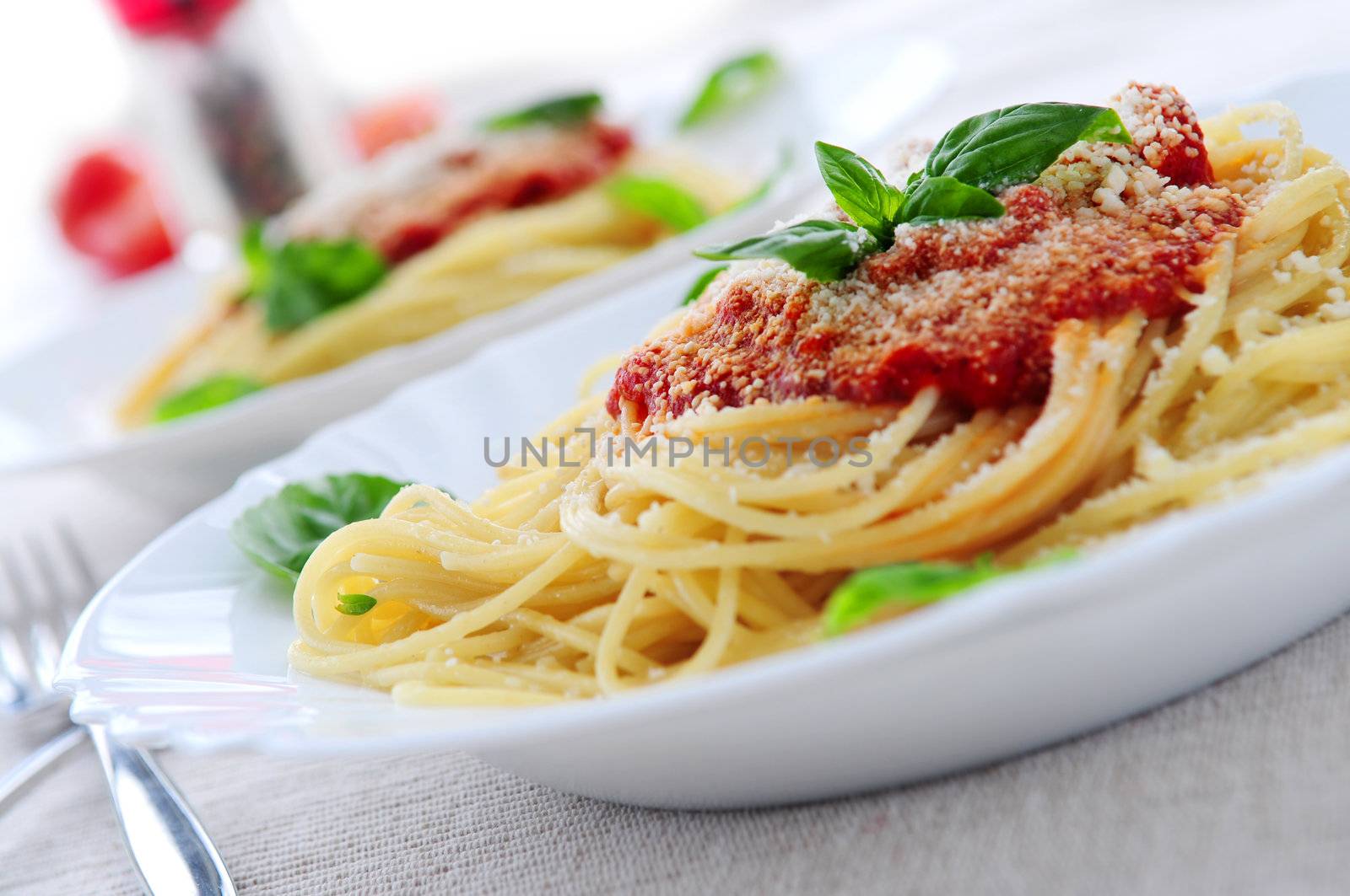 Pasta with tomato sauce basil and grated parmesan