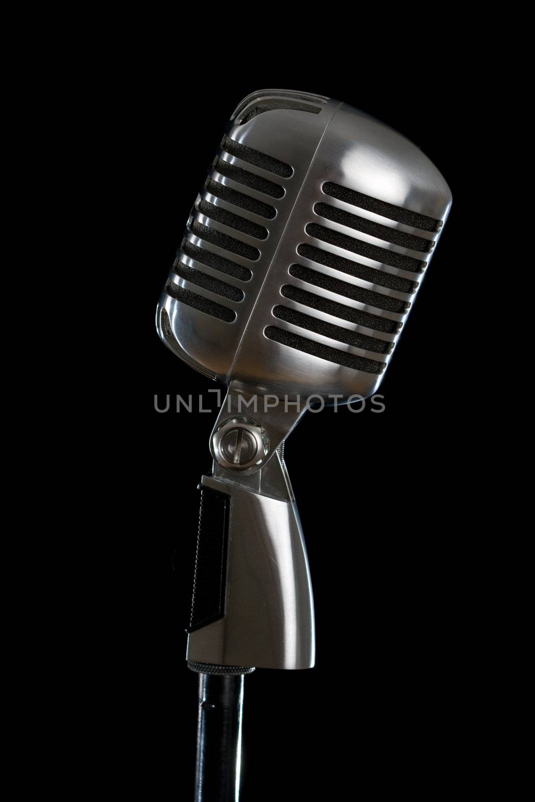 Retro microphone isolated on the black background