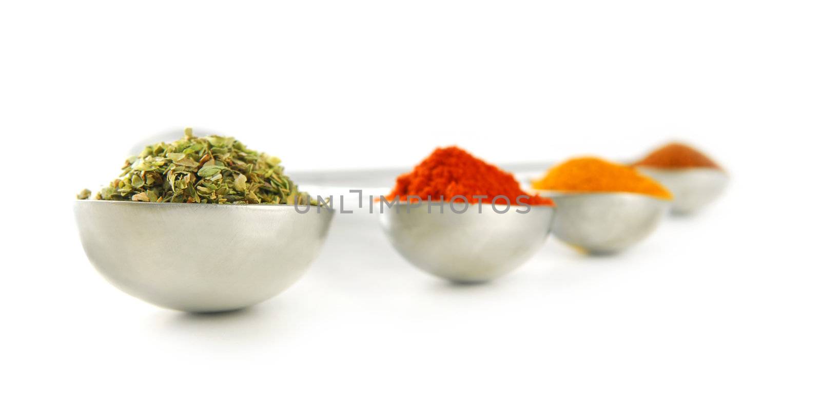 Spices in measuring spoons by elenathewise