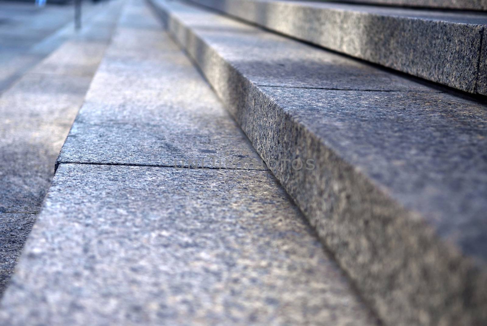 Stairway with granite stone steps in perspective, close up