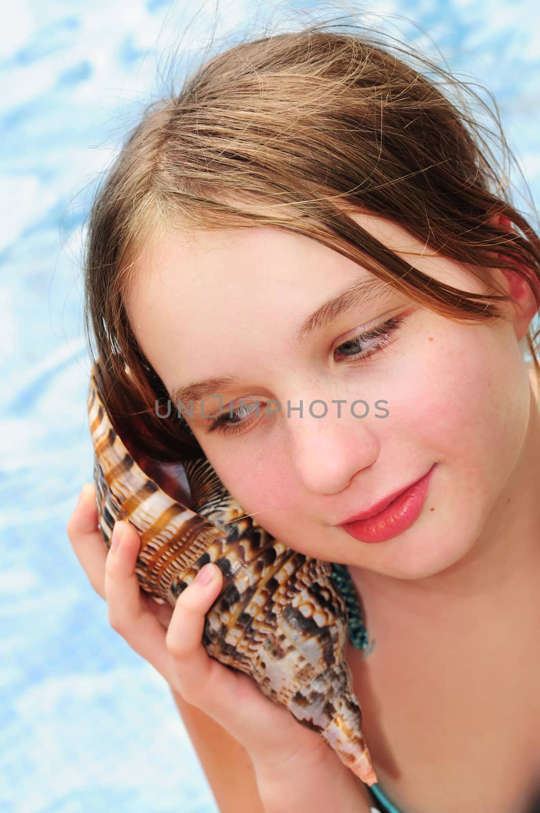 Young girl with seashell by elenathewise