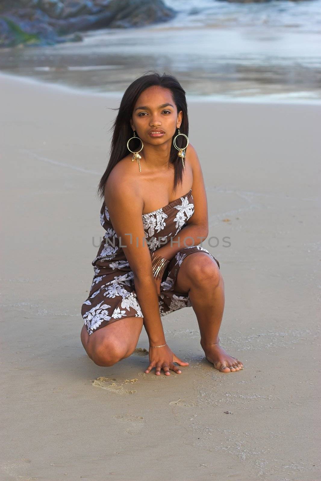 Caribbean girl on the sand at the beach