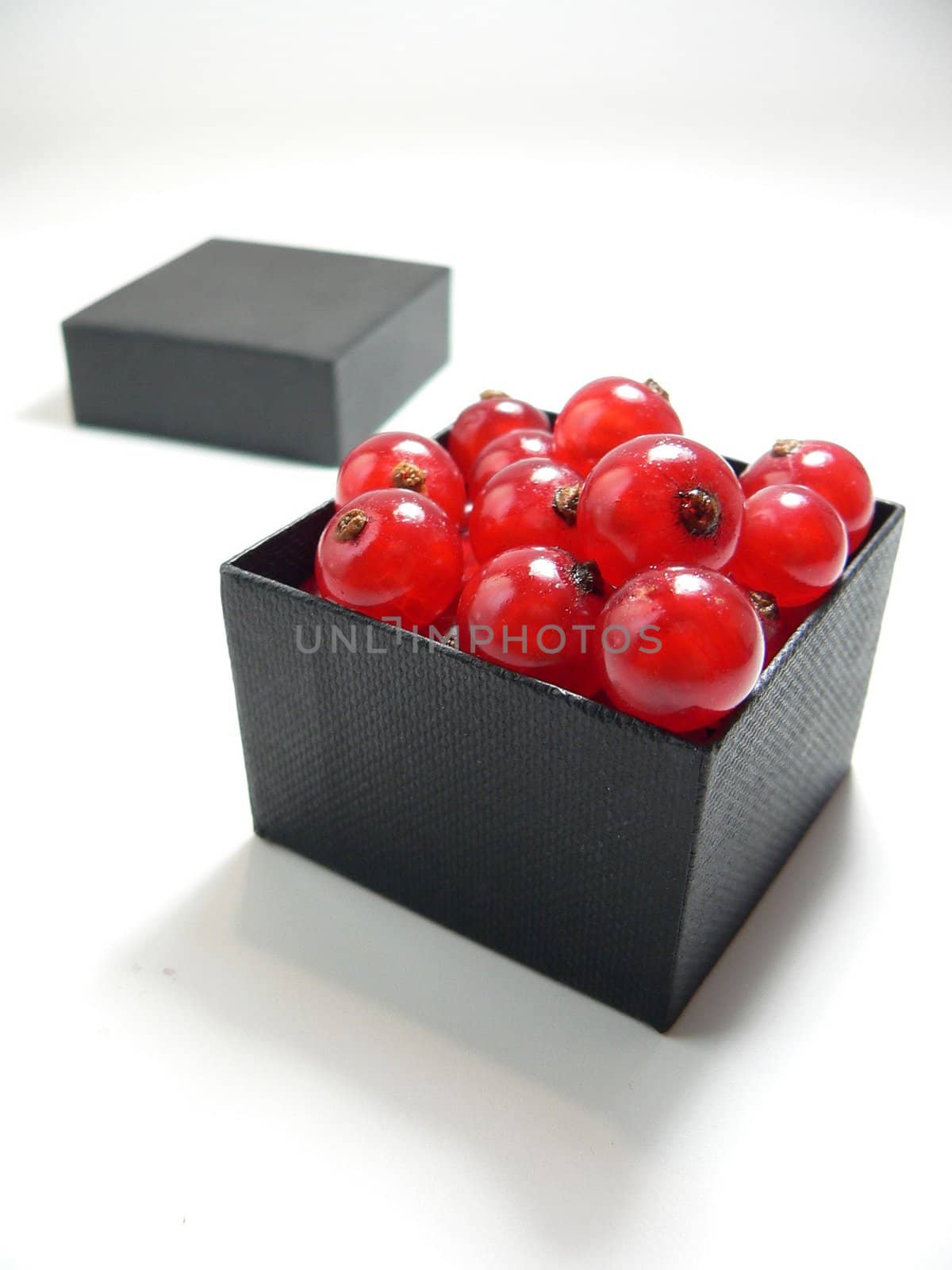 red ribes berries in a black box
