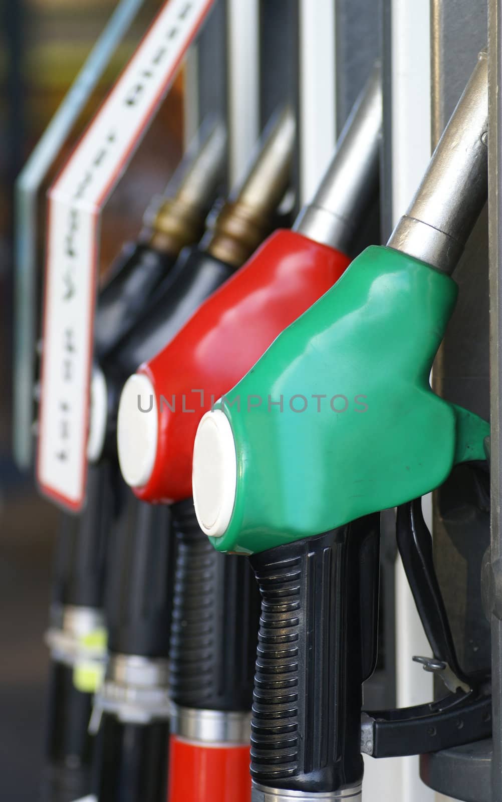 Close up of four gasoline pumps.