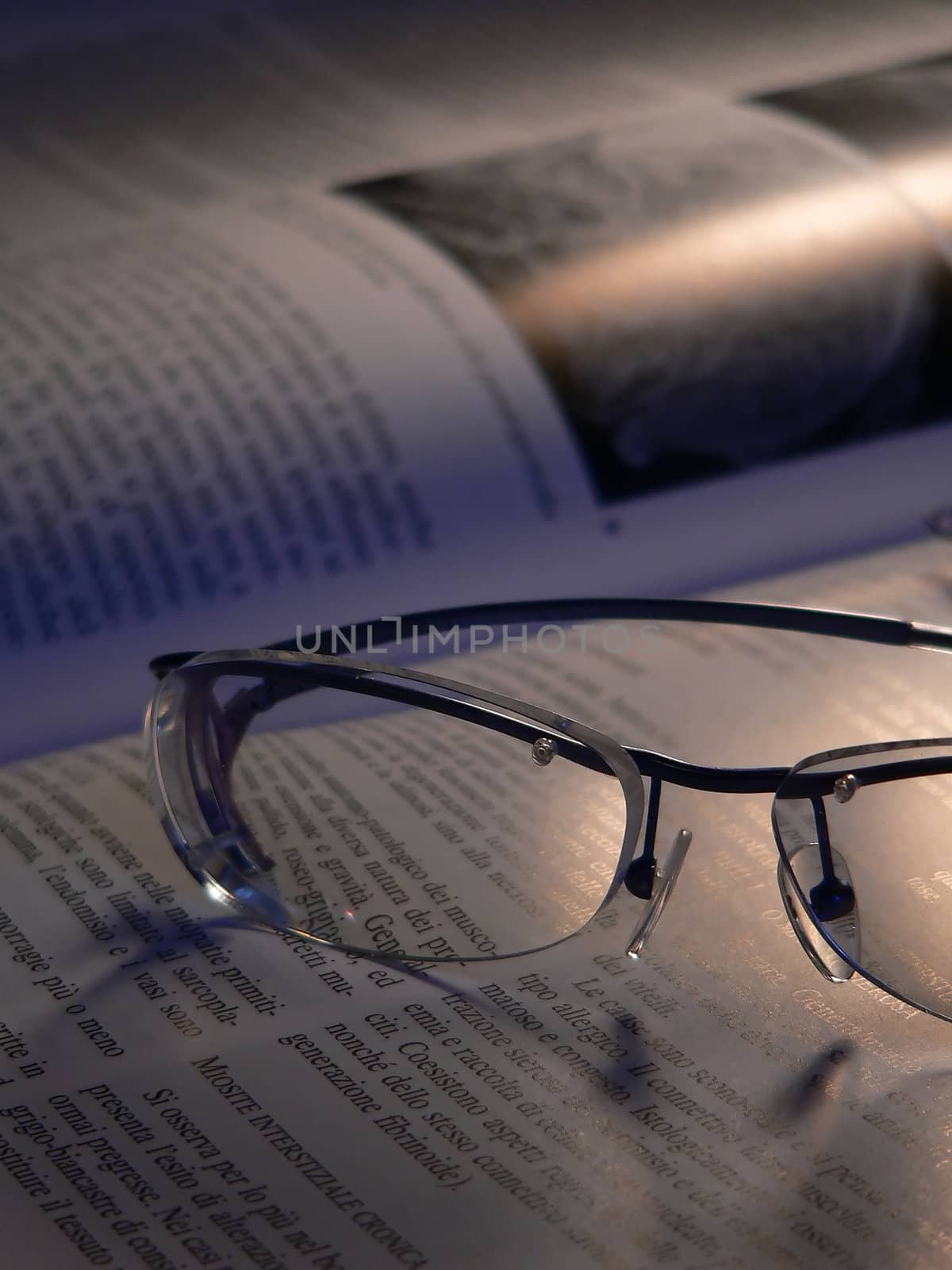 a pair of glasses on a book