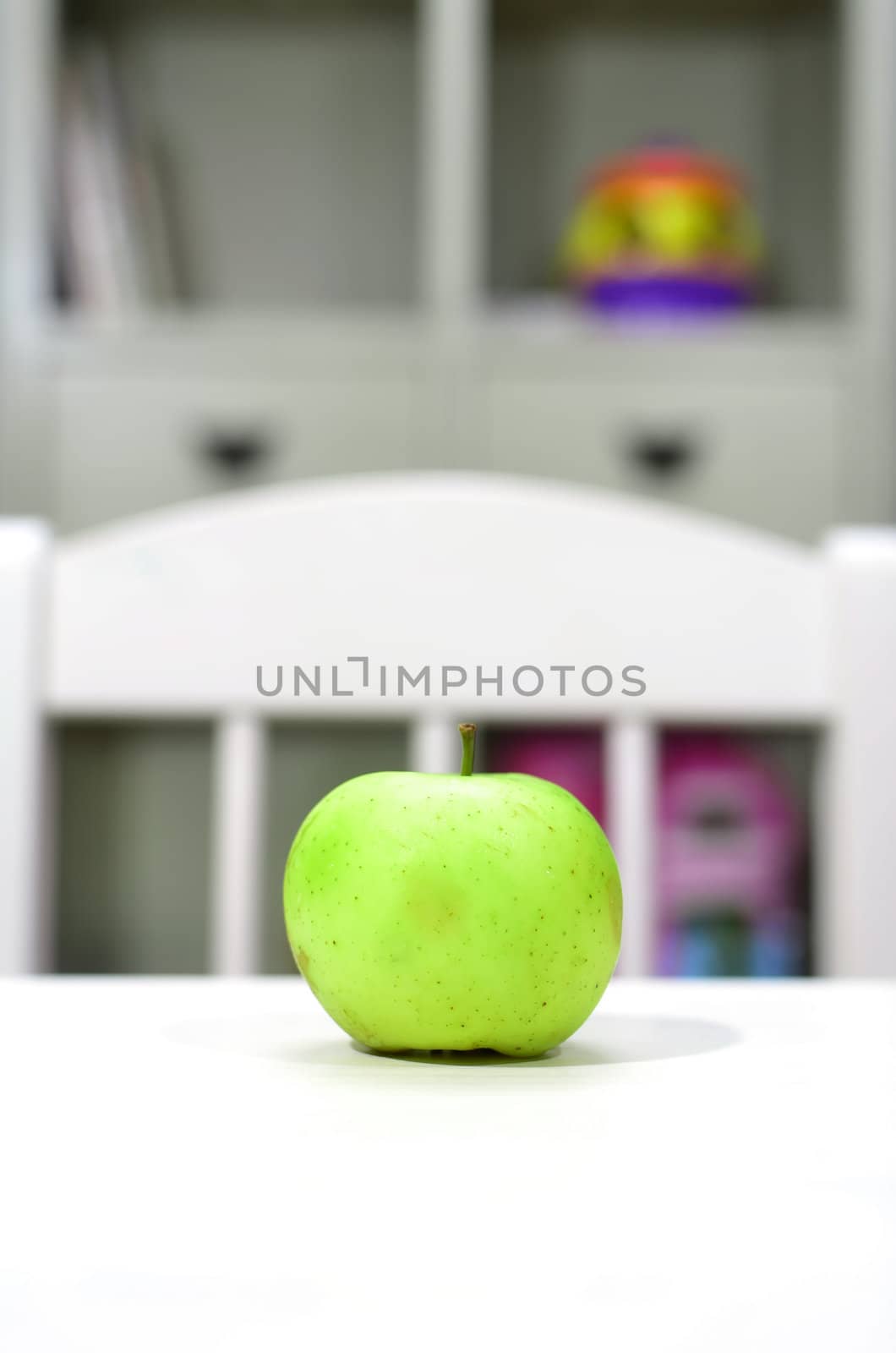 green apple on the table in the nursery