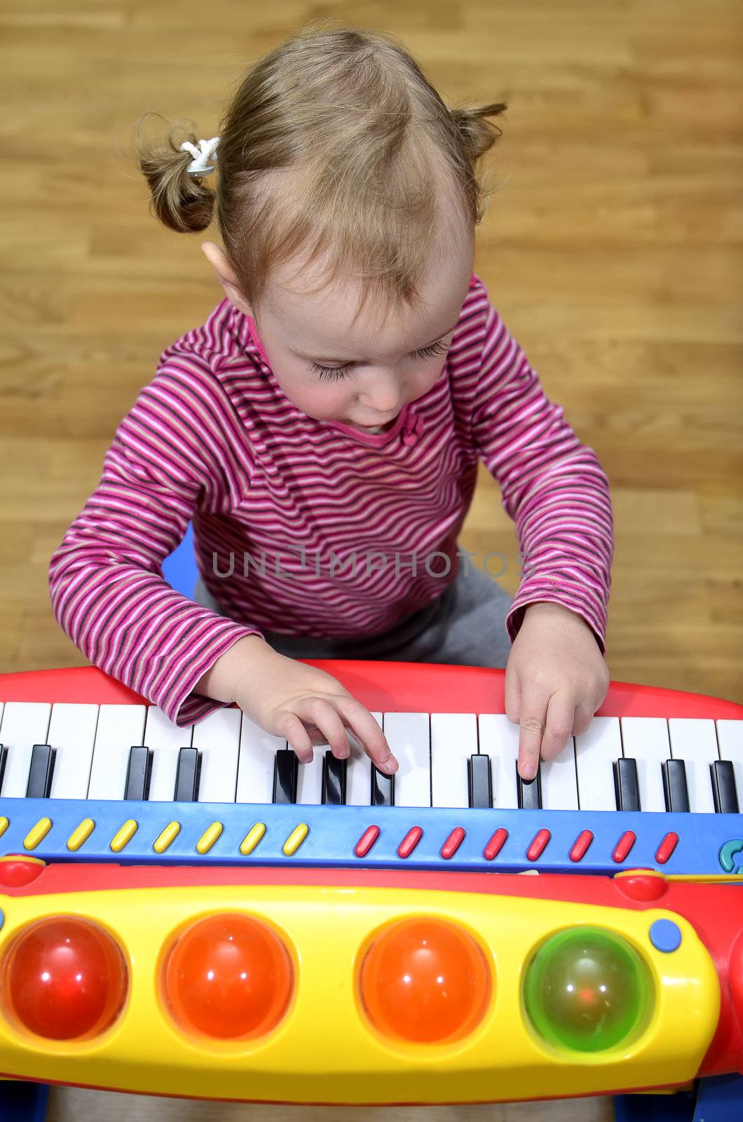 little girl playing the piano