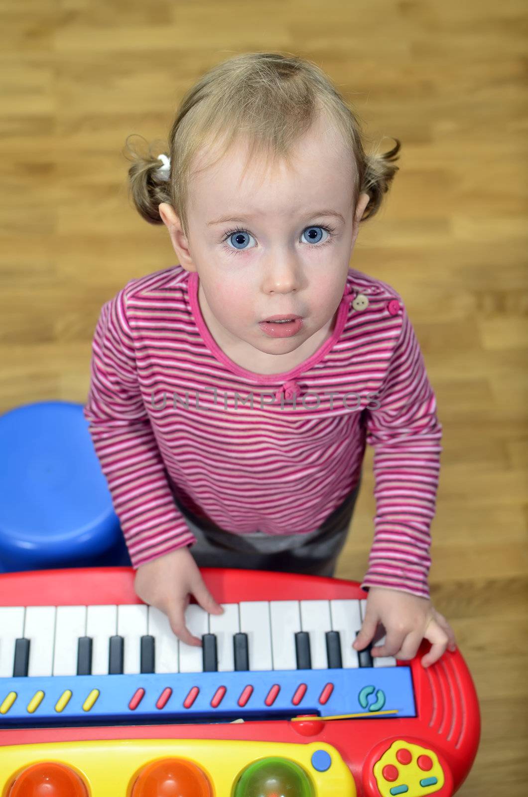 little girl playing the piano