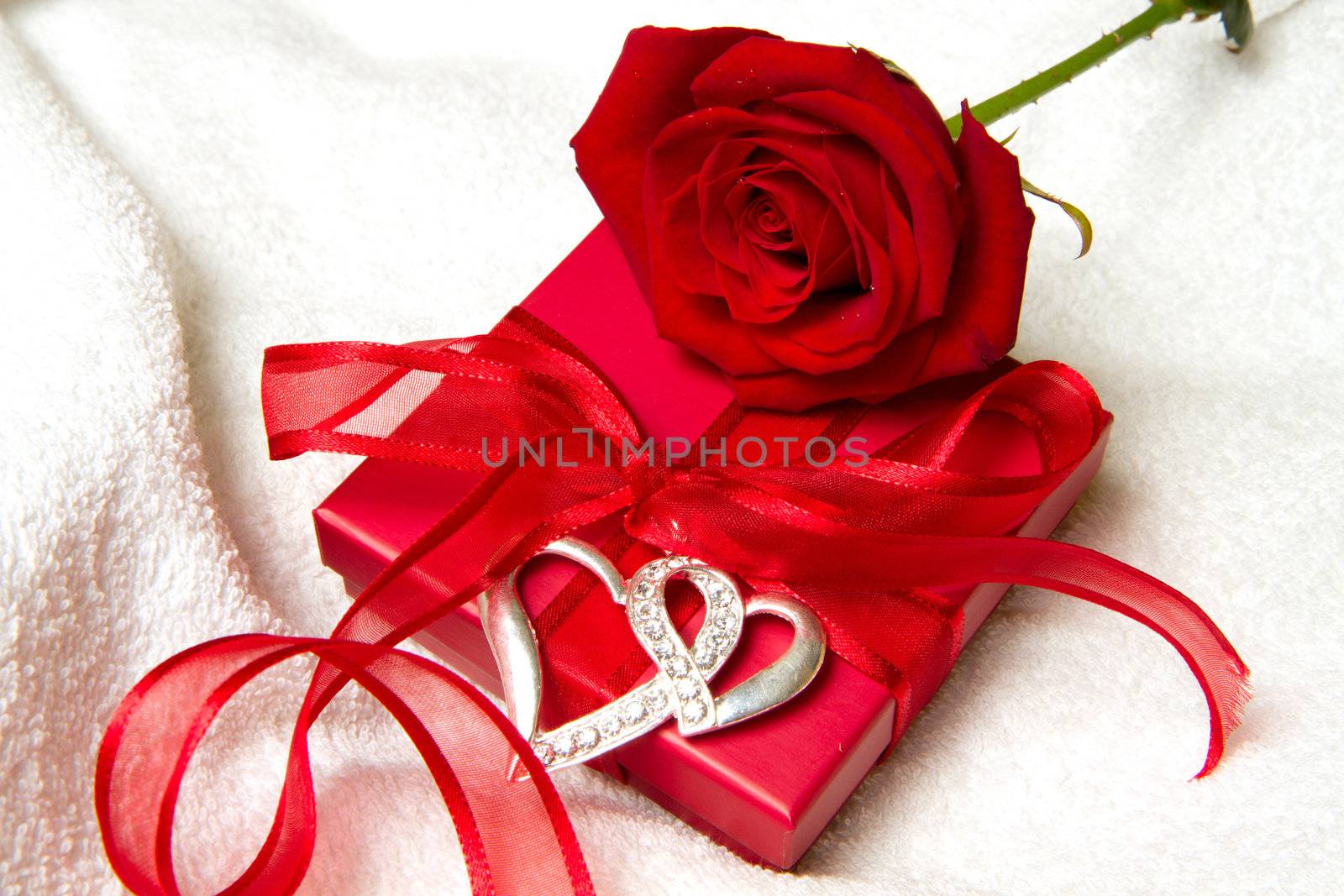 red gift with red rose