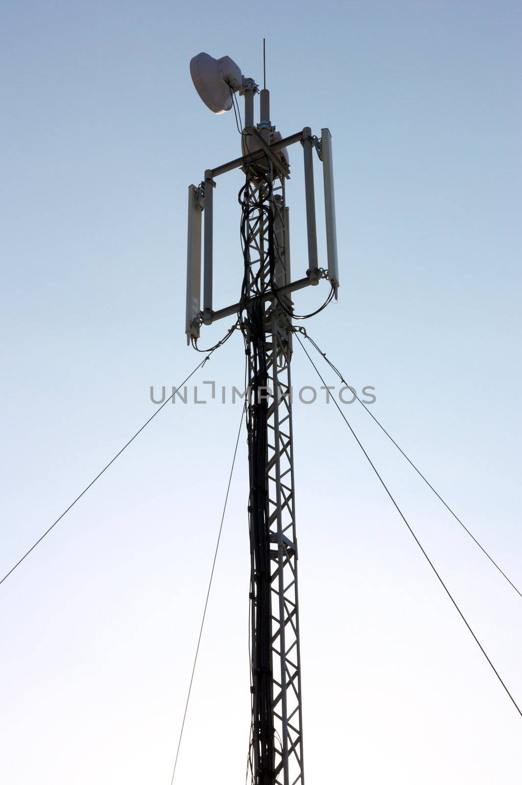 Aerial mobile communication against the blue sky on a sunset