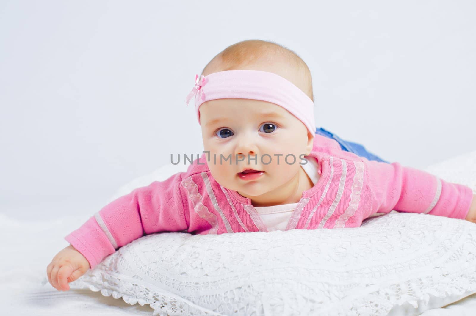 Clouse-up portrait pretty little girl in red isolated. In studio