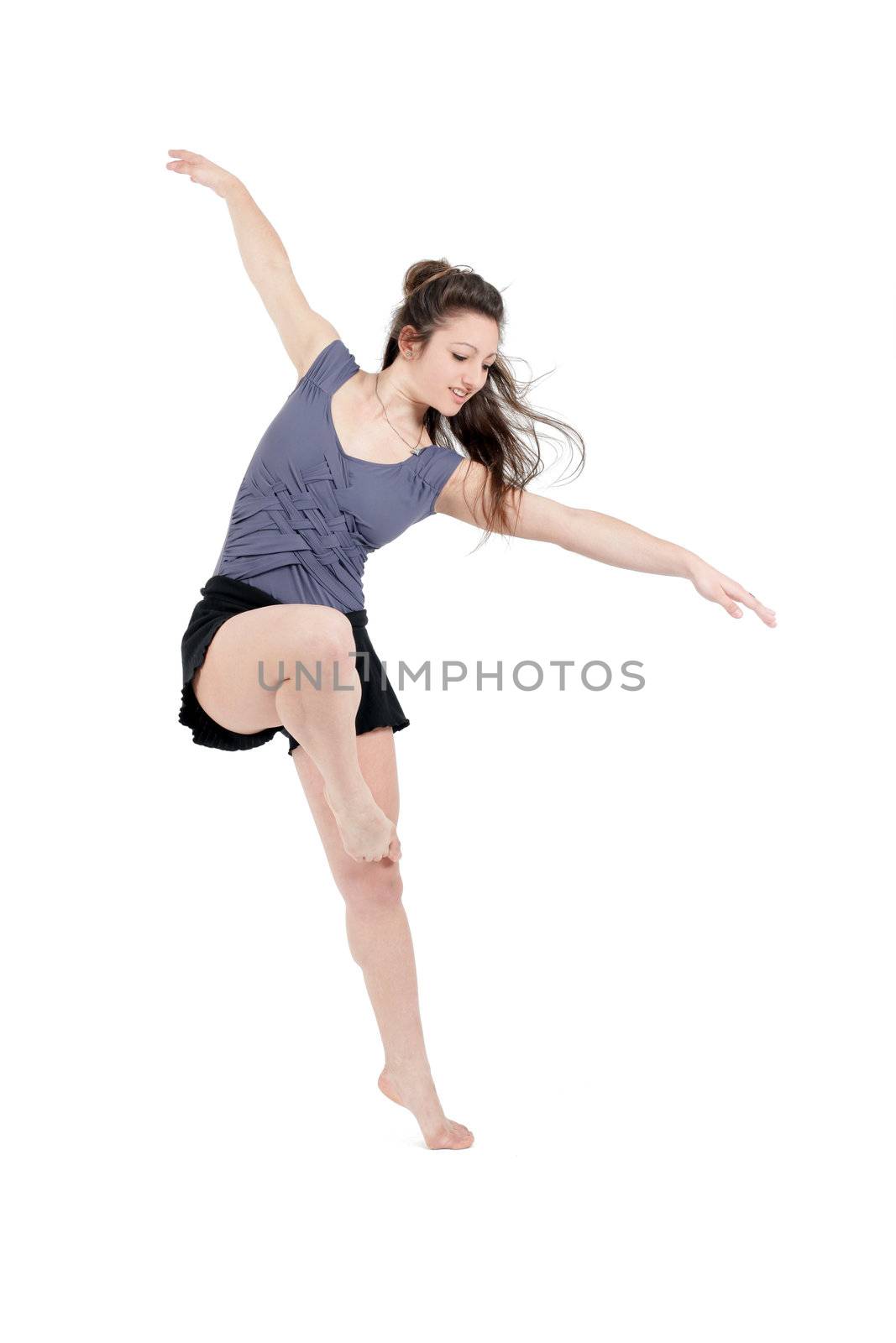 Young pretty teenage girl brunette dancing in studio by macintox