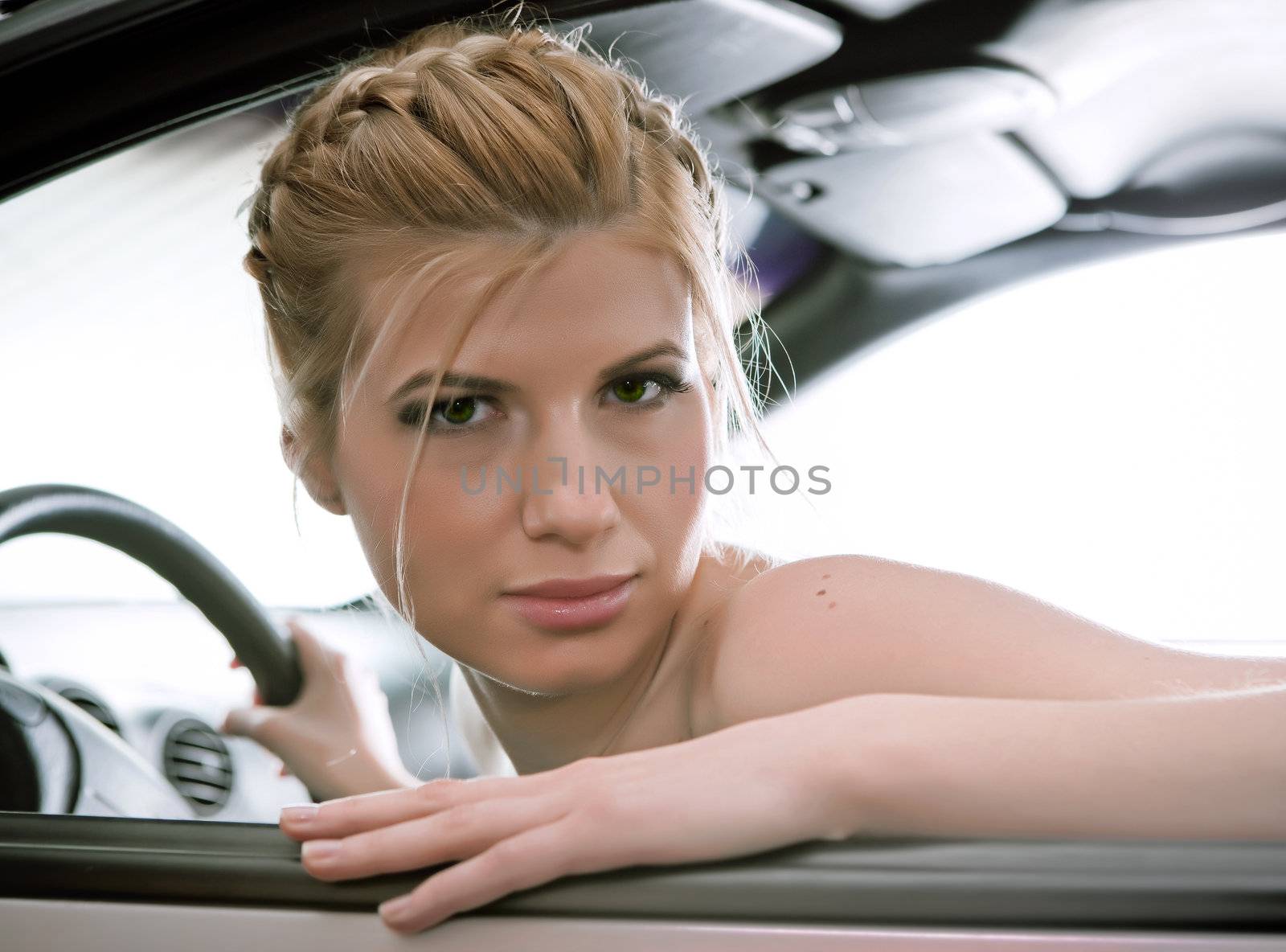   Young sexual blonde in the car.